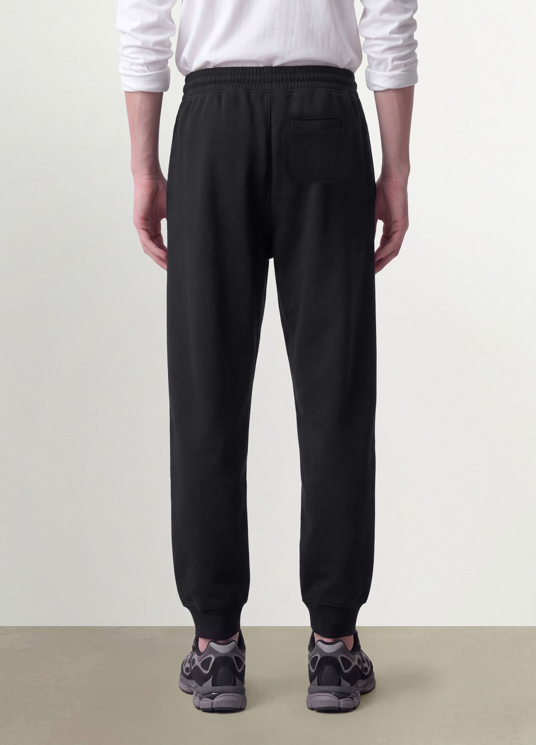 Jogger neri in misto cotone con fondo a polsino e coulisse