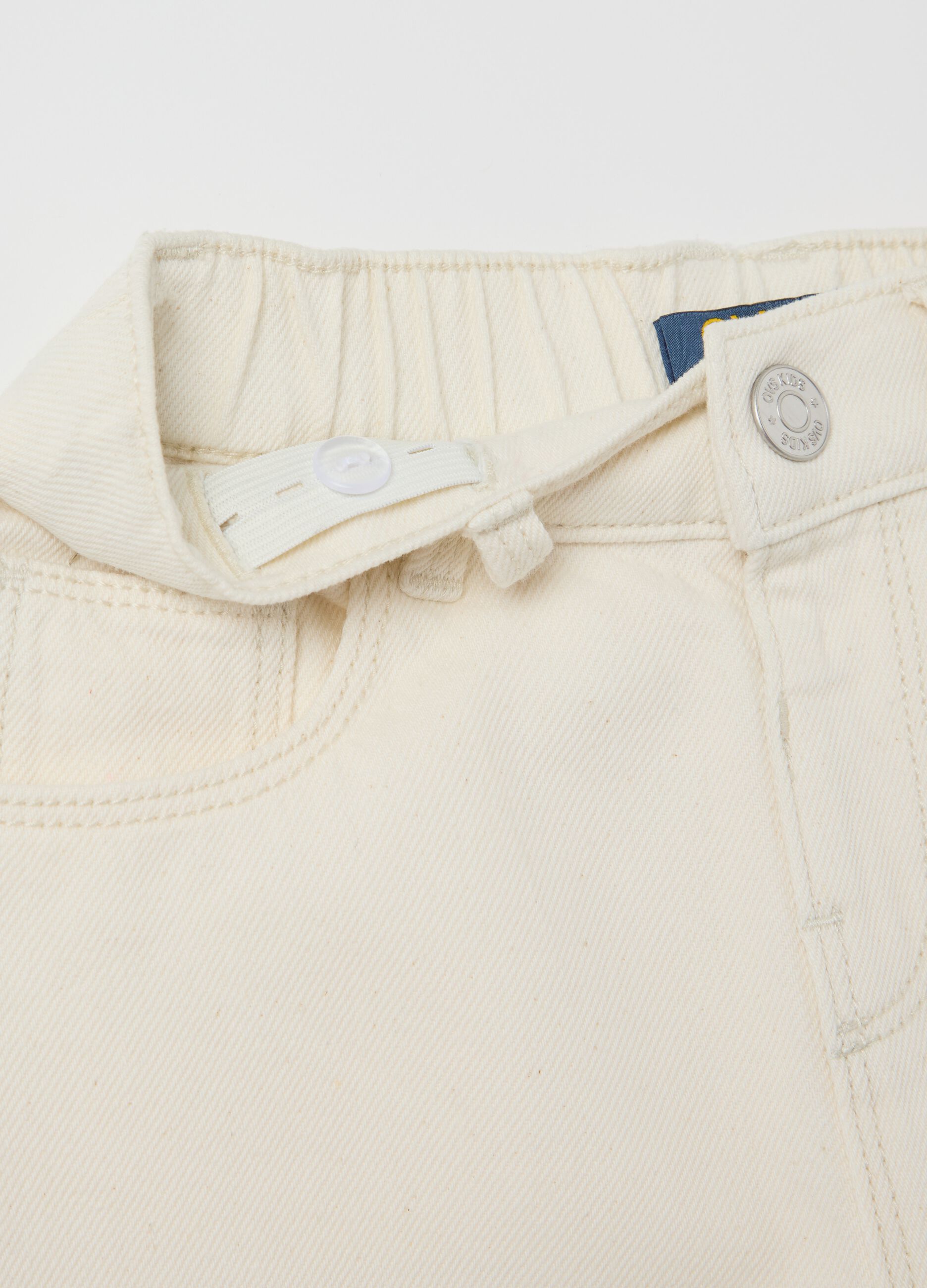 Drill trousers with openwork floral embroidery
