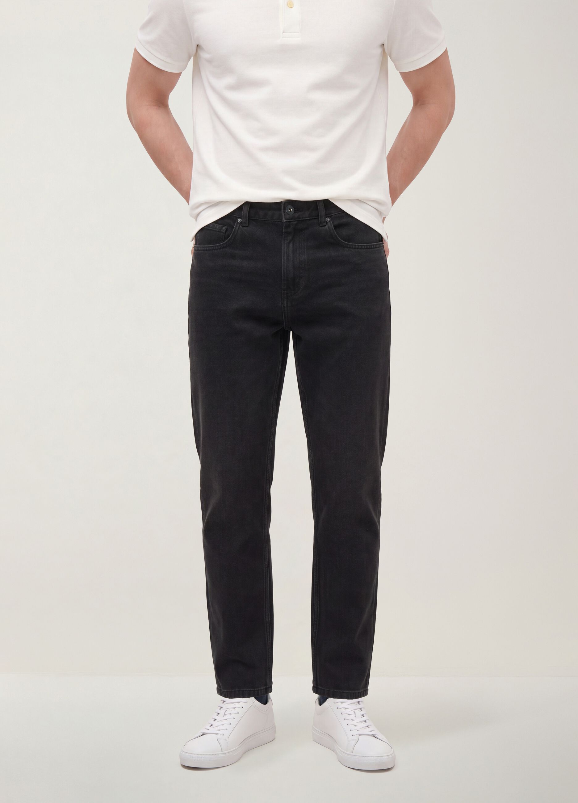Black regular tapered jeans in a cotton, lyocell and viscose blend