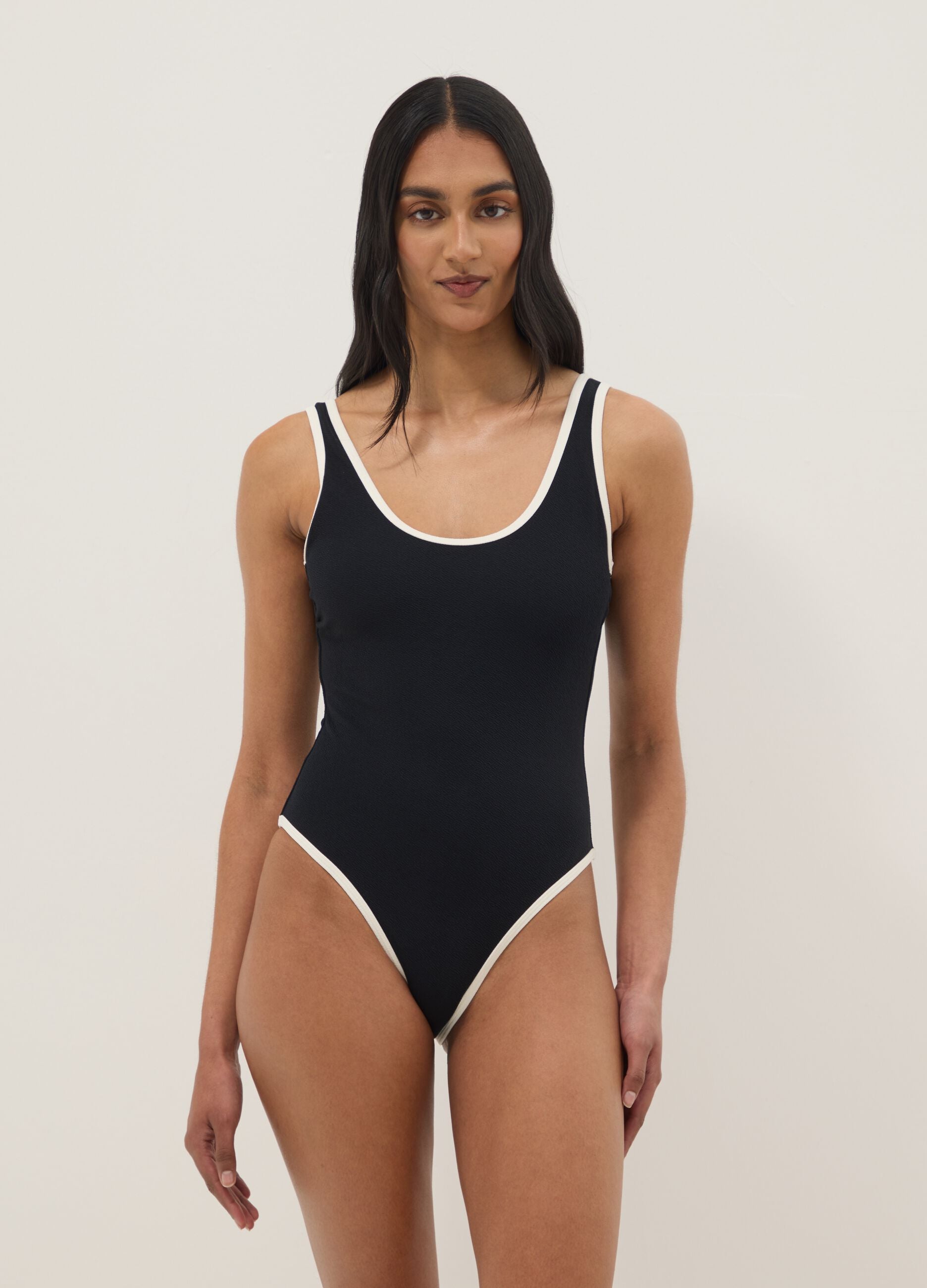 Black stretch one-piece swimsuit with white trim