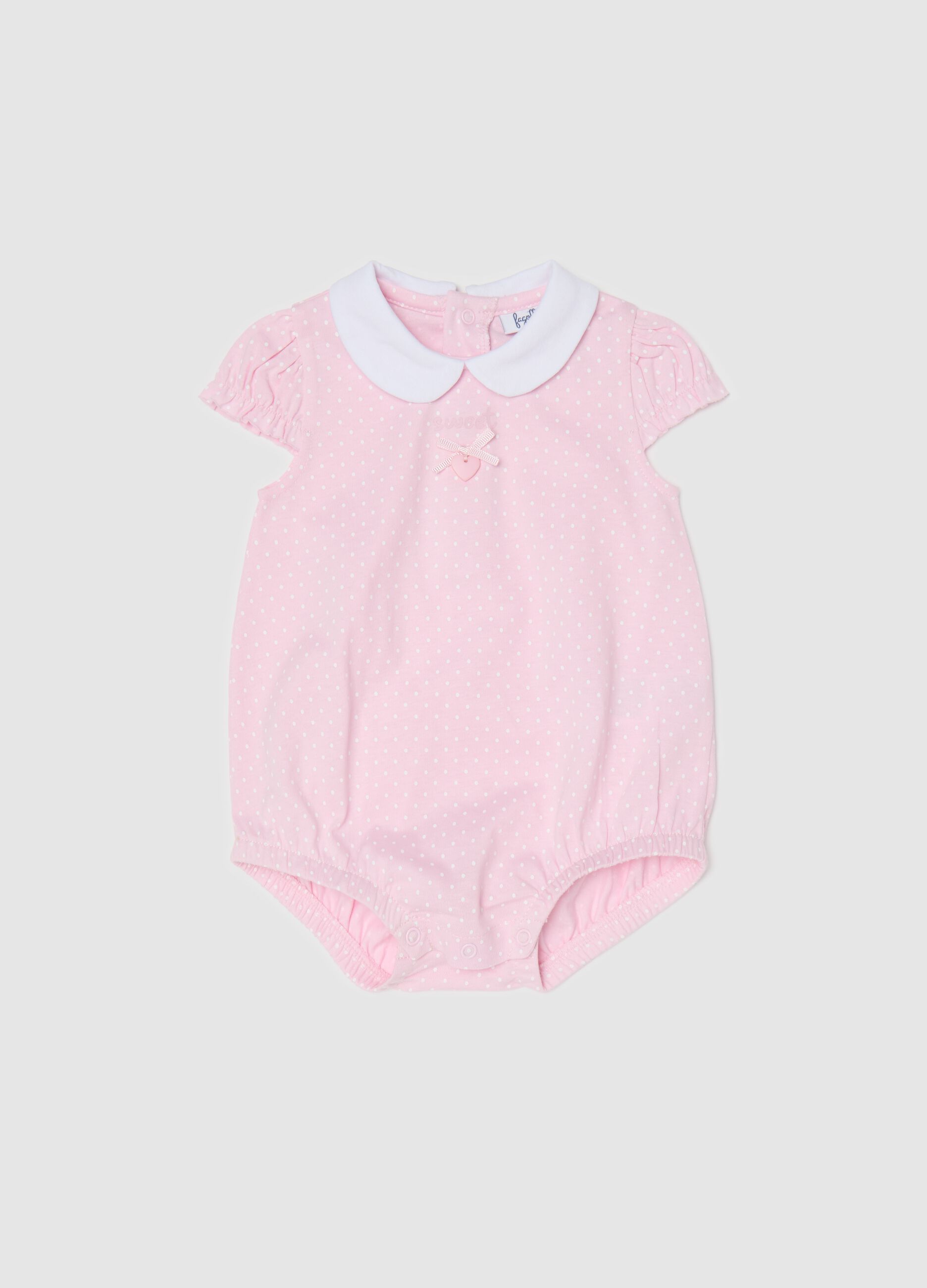 Pink romper suit in organic cotton with micro polka dot pattern