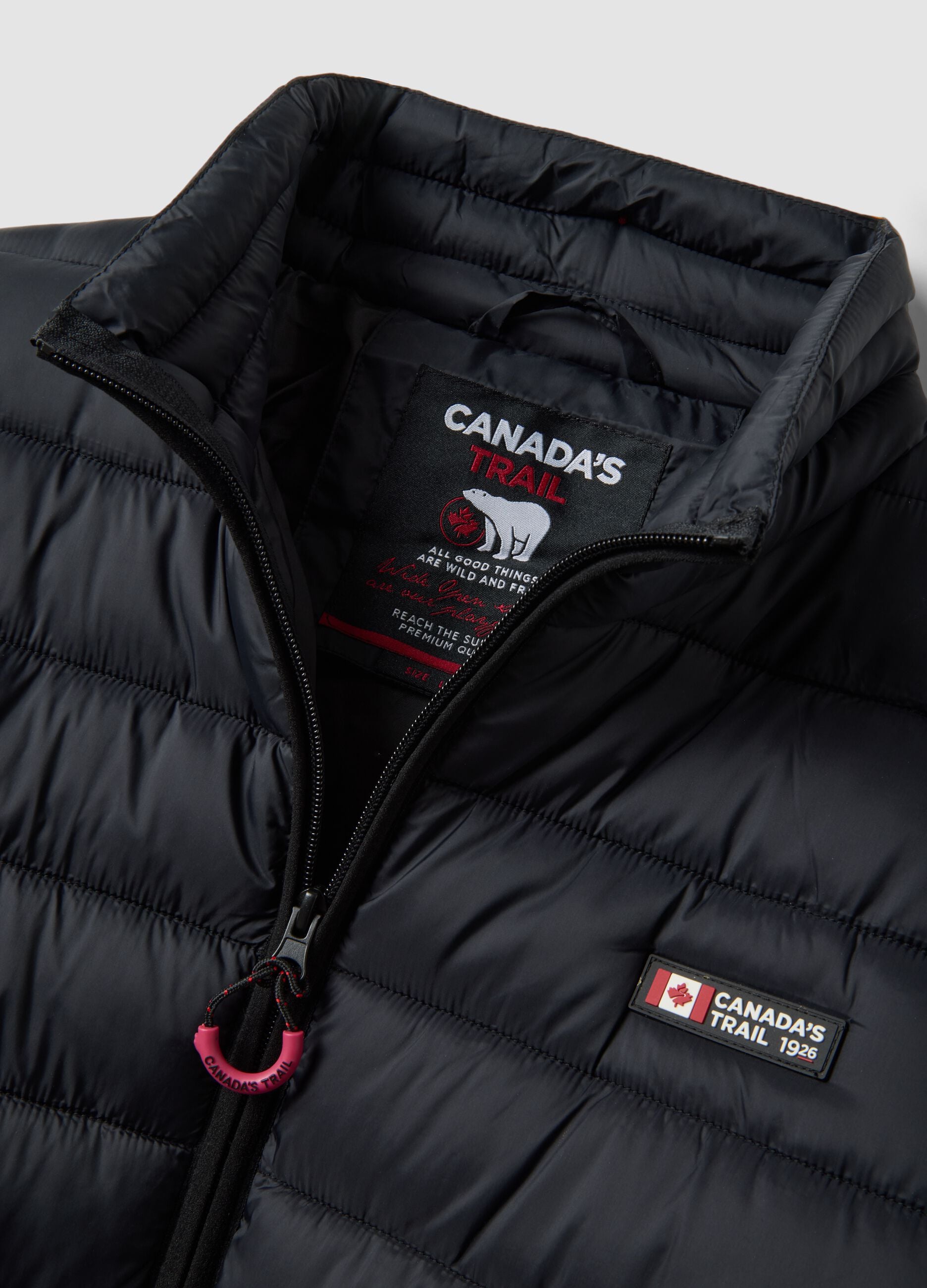 Black padded jacket with high neck and zip