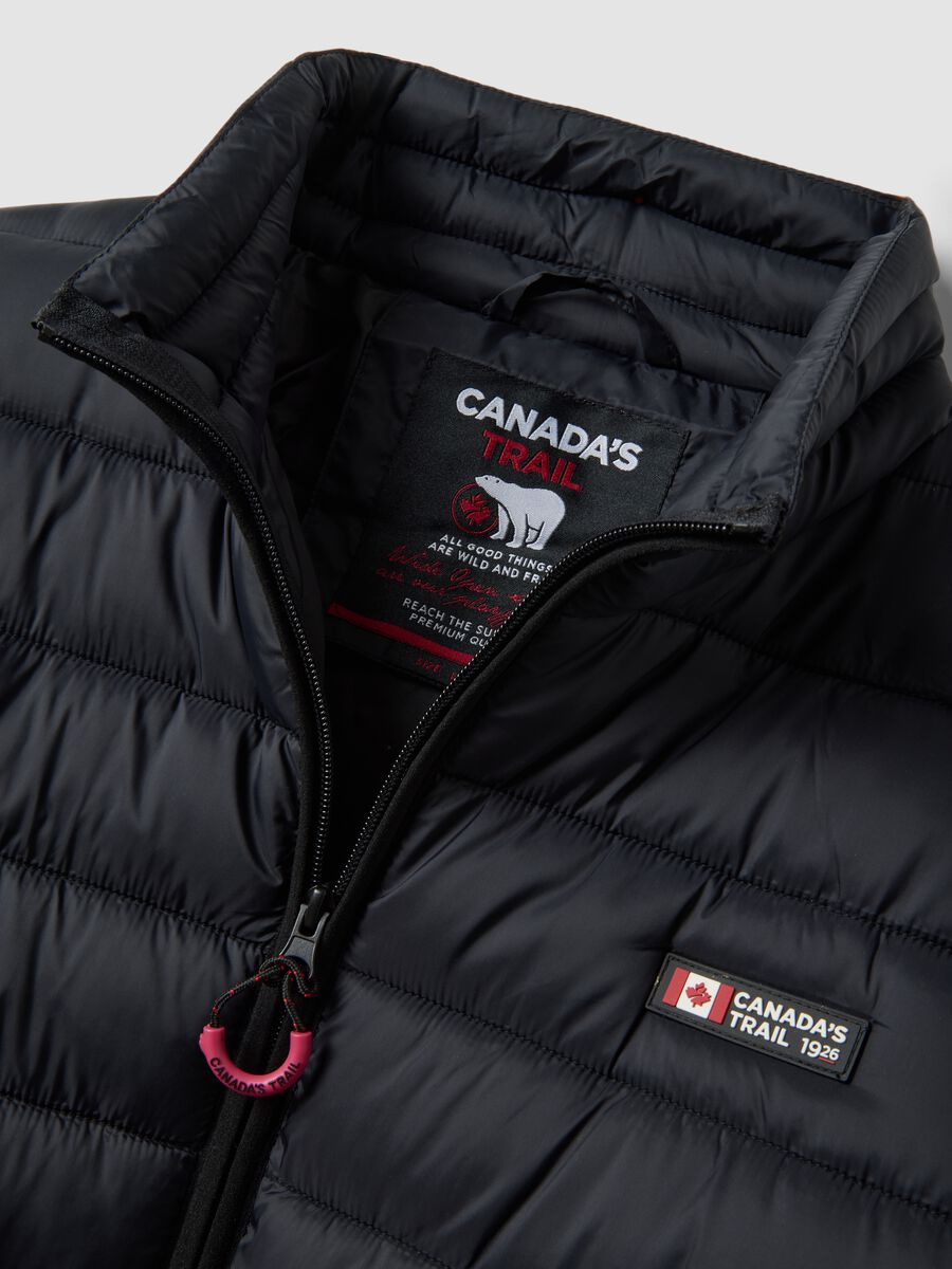 Black padded jacket with high neck and zip_1