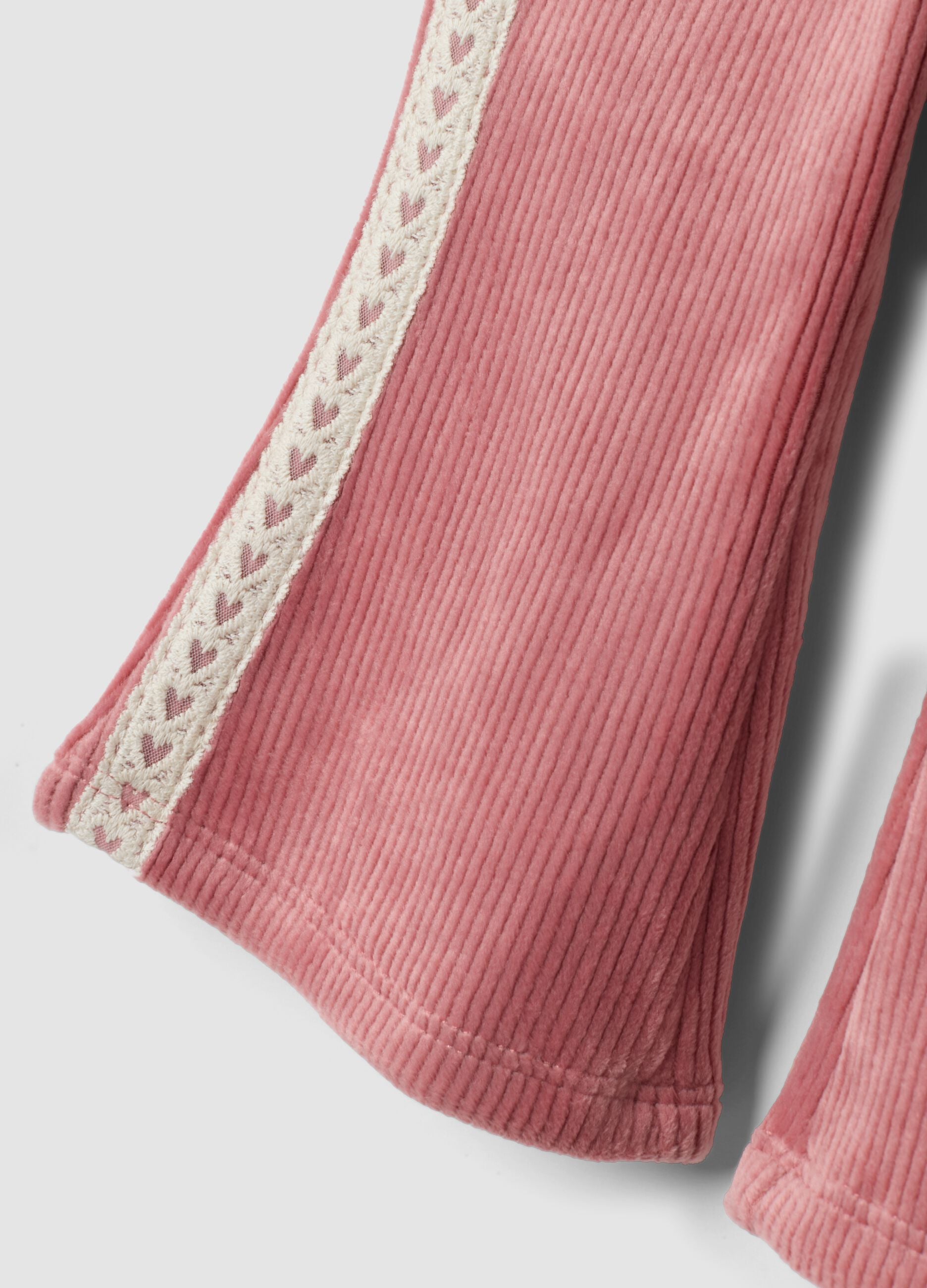 Pantaloni flare rosa in tessuto elasticizzato a costine