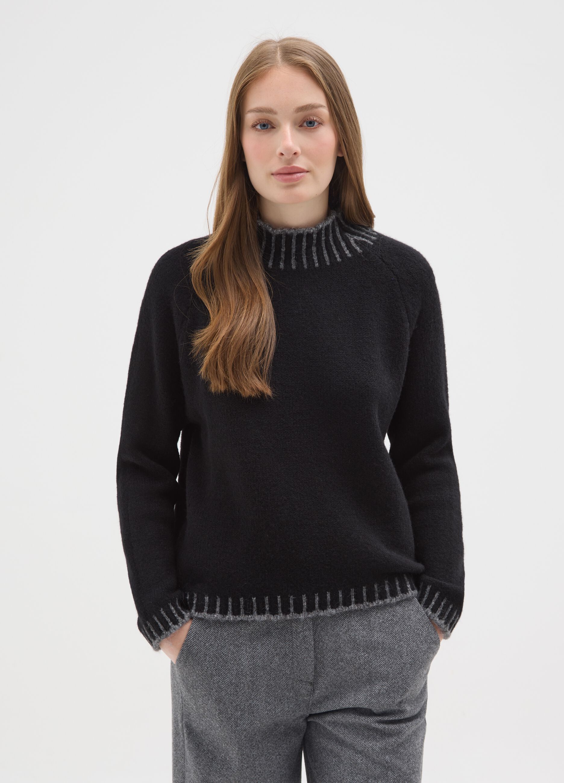 Black regular fit sweater with ribbed collar and cut-out details