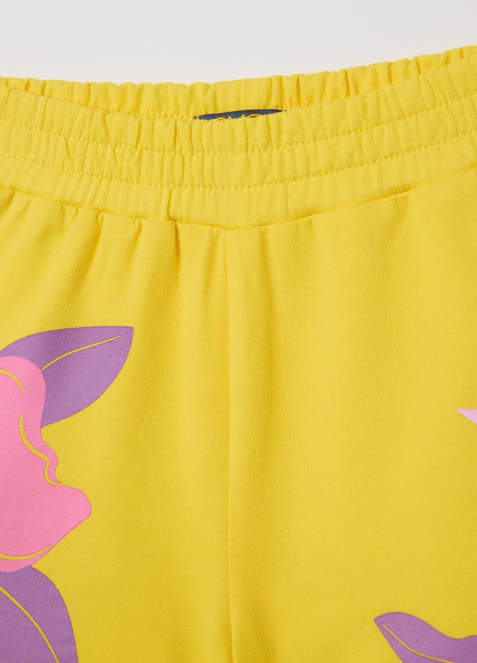 Yellow French terry shorts with print