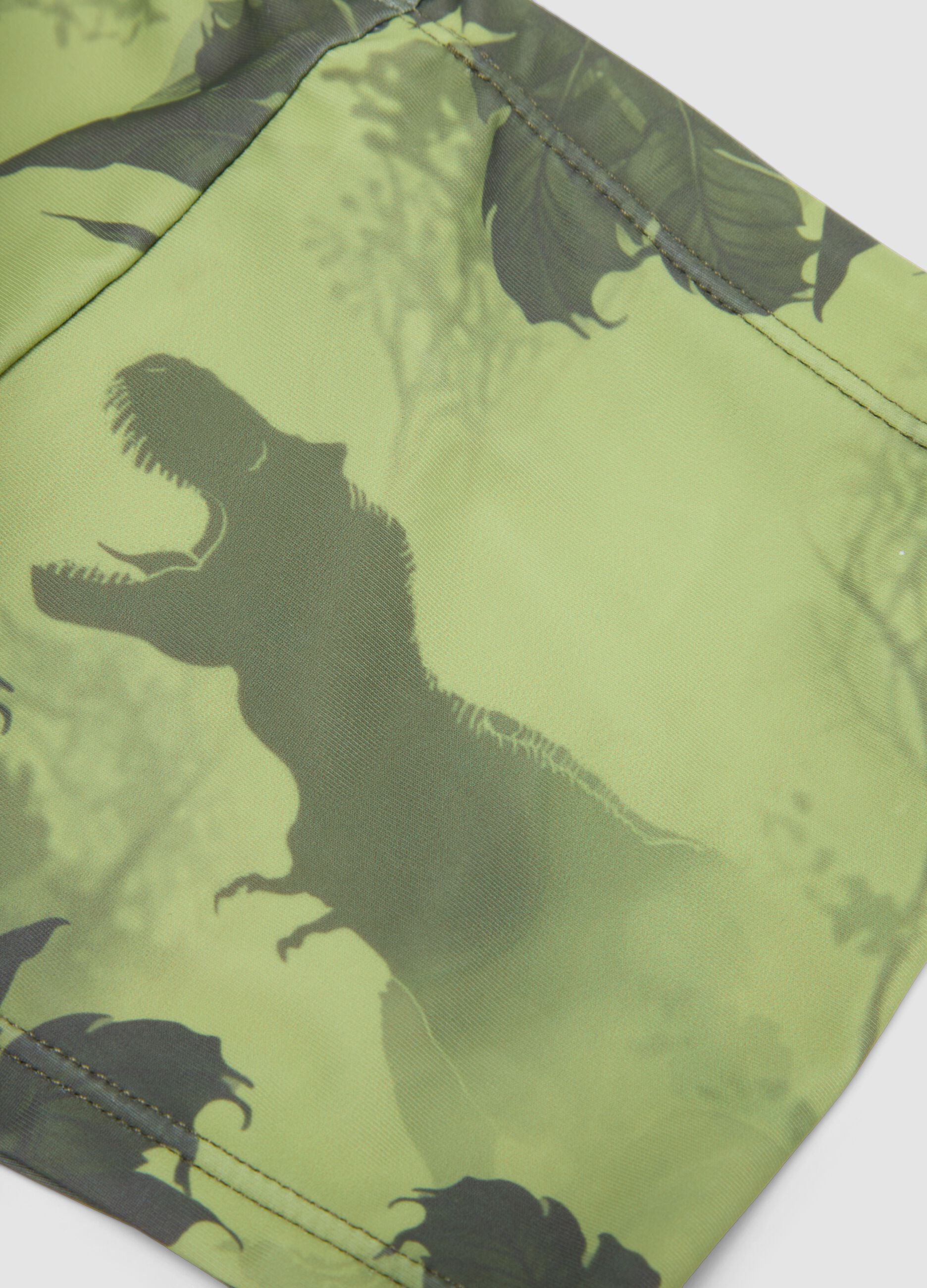 Green dinosaur-print stretch swim trunks