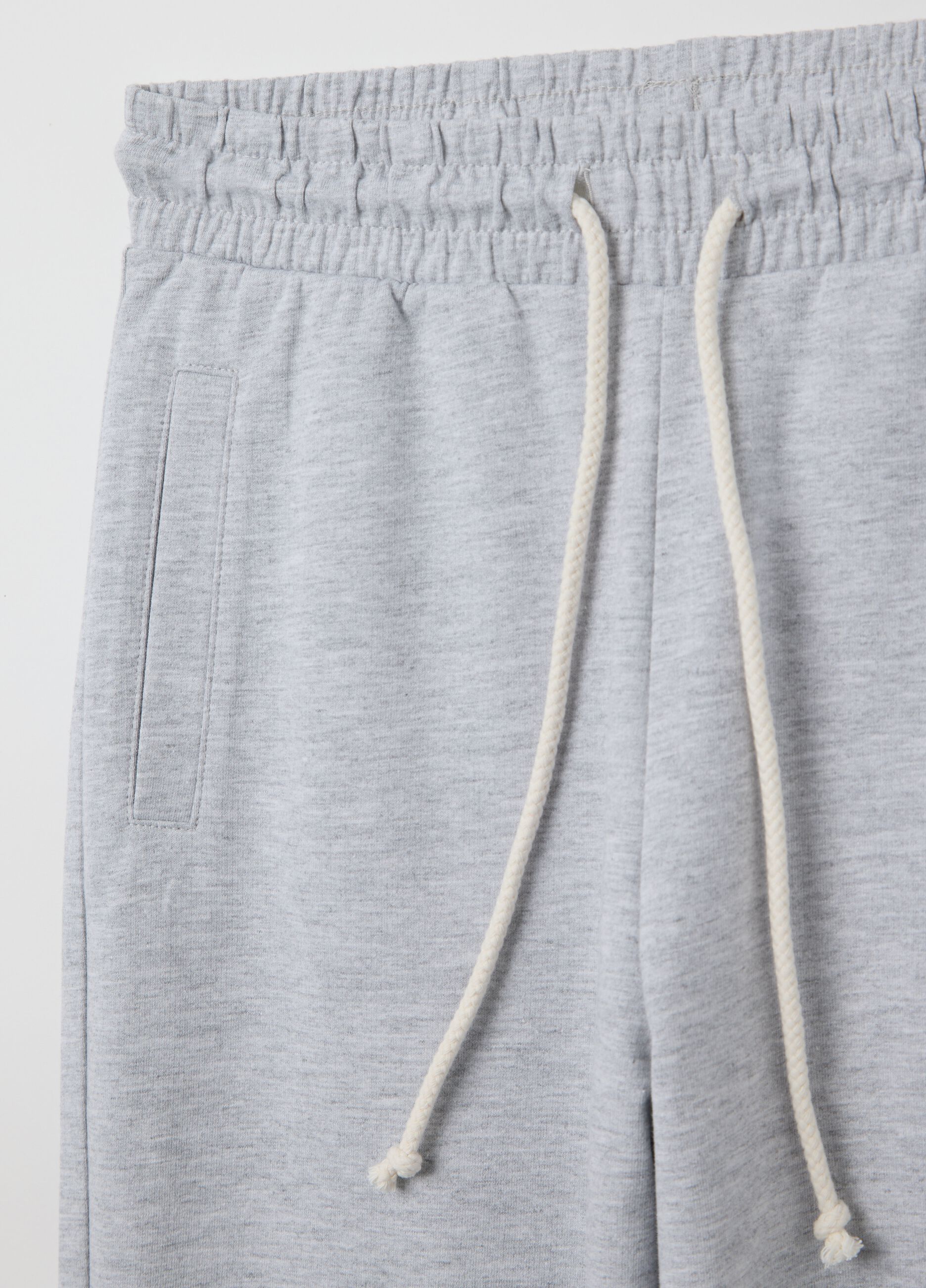 Grey joggers in French terry with drawstring