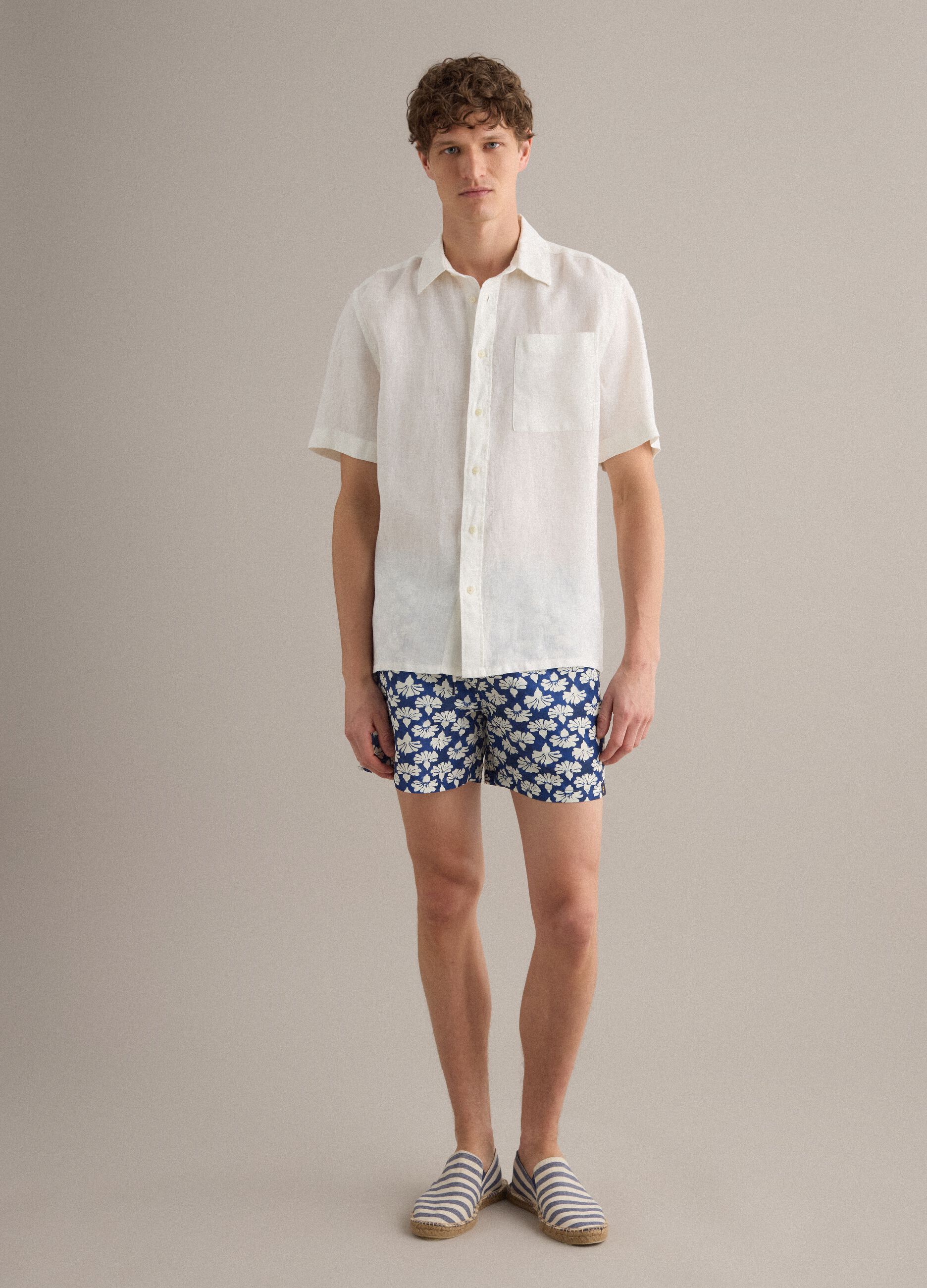 Blue floral-print swim shorts