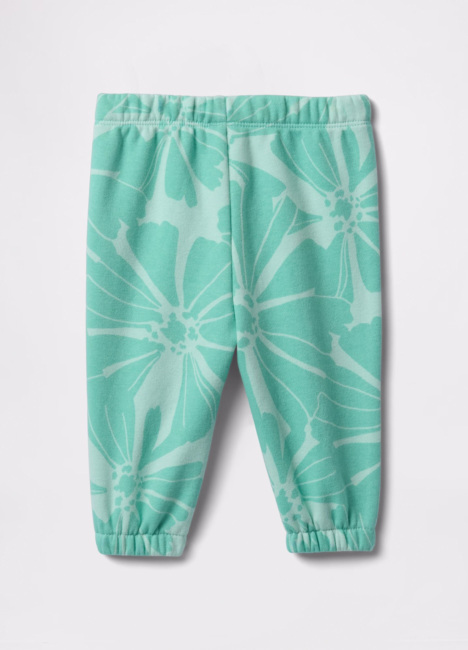 Light blue joggers with drawstring, logo embroidery and flowers print