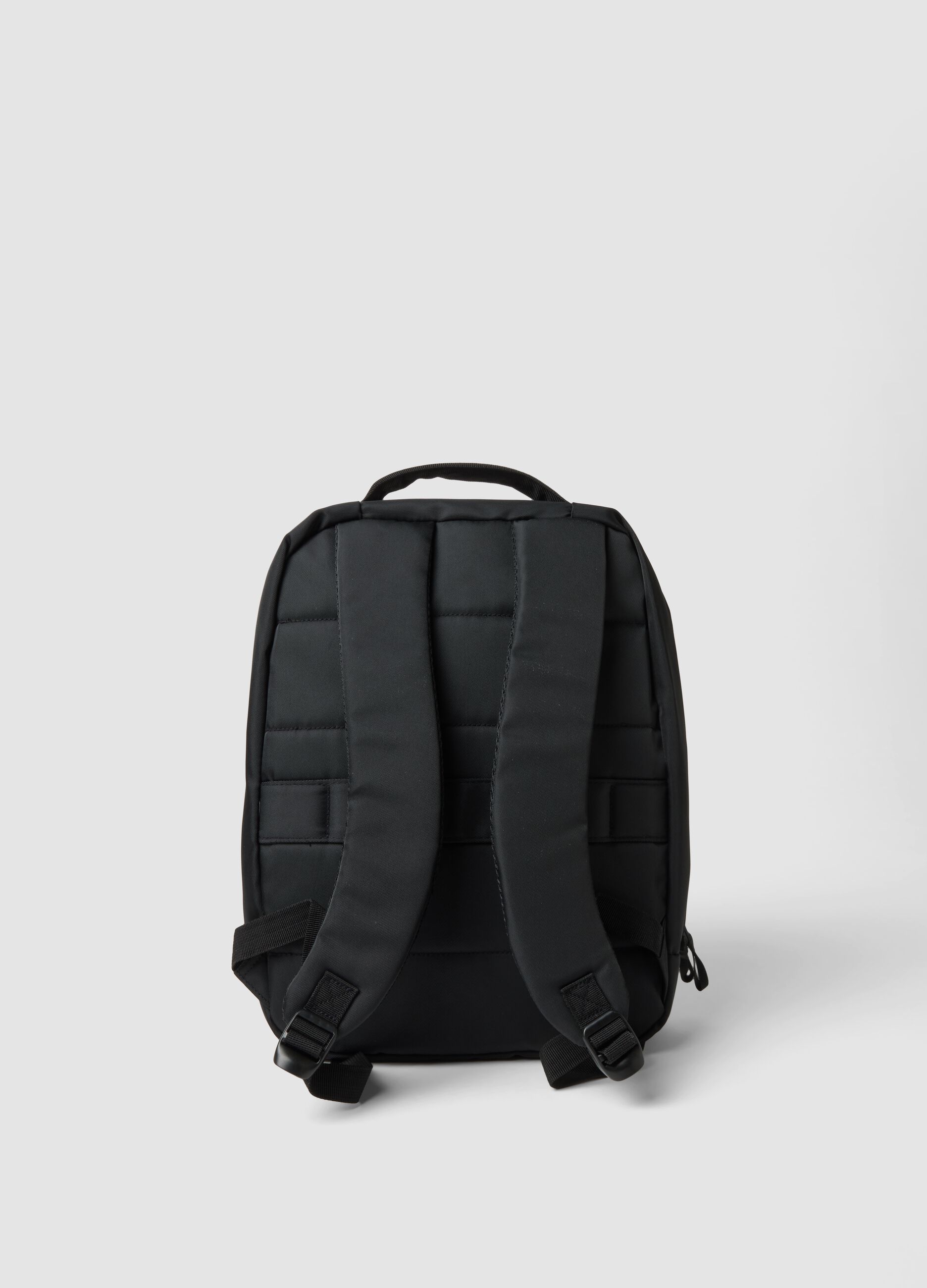Black water-repellent backpack with front pocket and padded shoulder straps