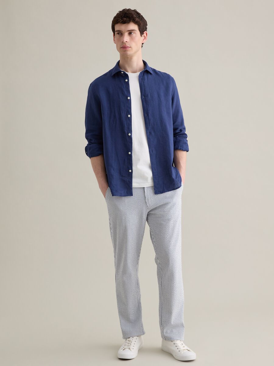 Seersucker chino trousers with white and blue stripes_0