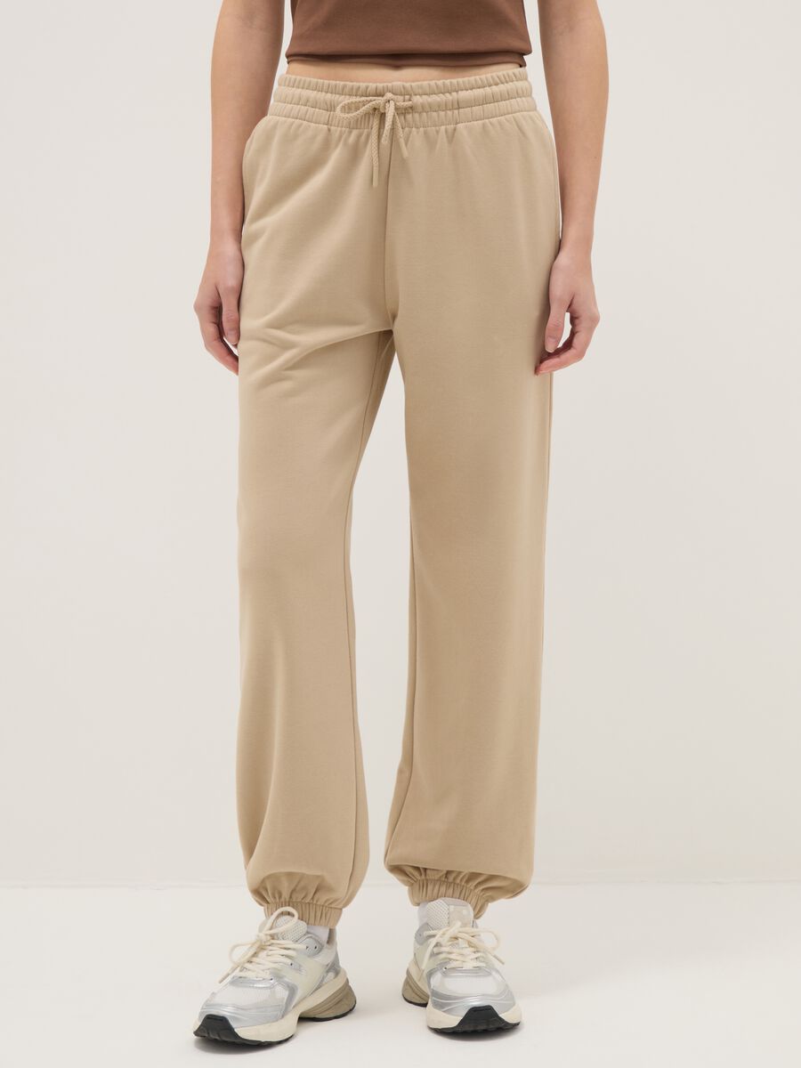 Beige cotton blend regular fit jogger trousers_1