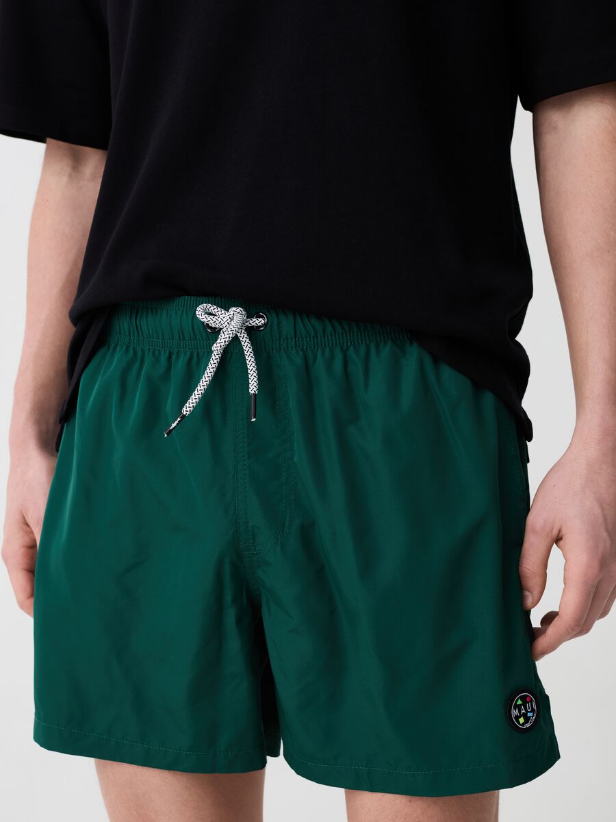 Swimming trunks with logo patch_1