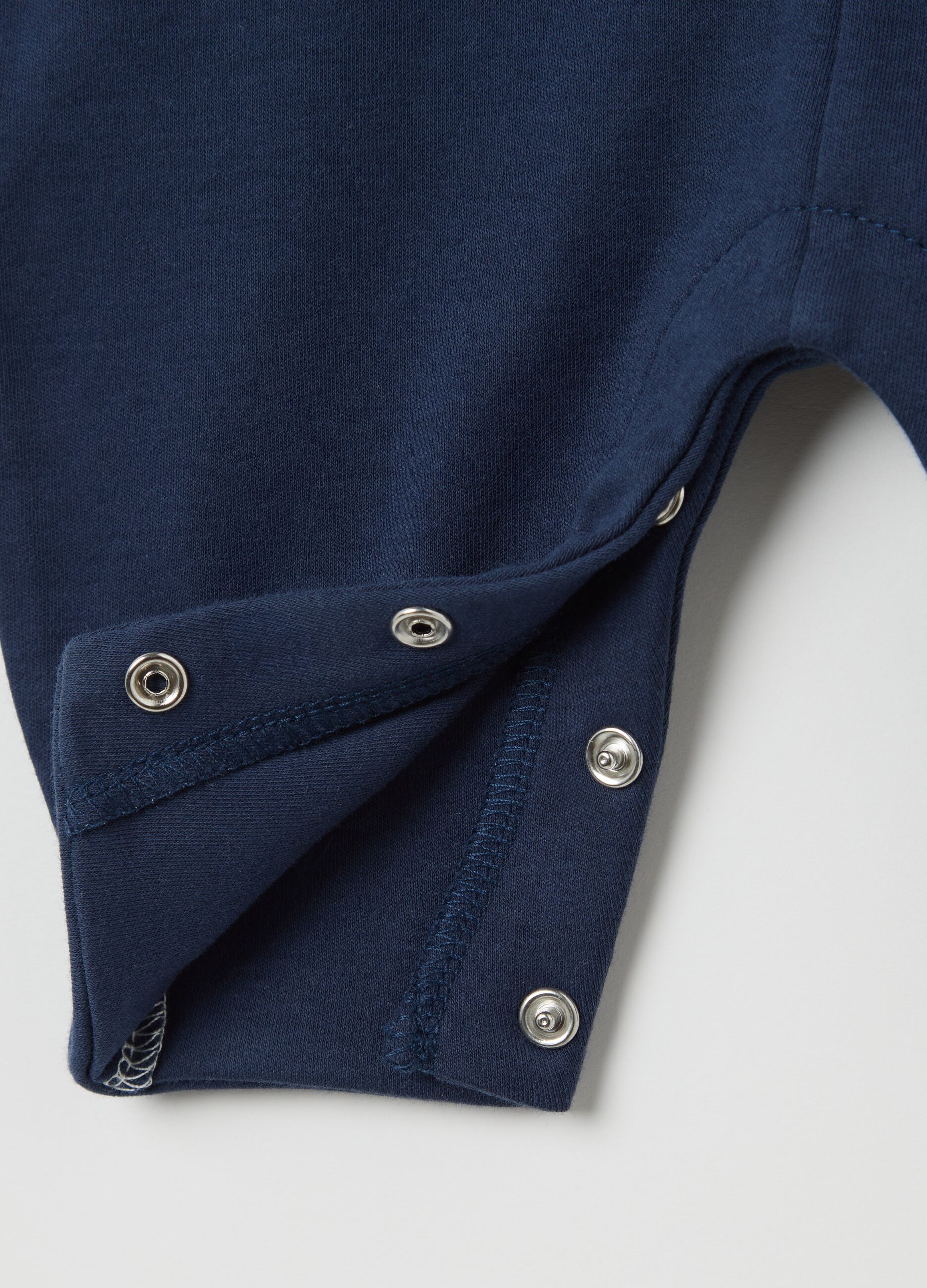 Blue two-tone cotton onesie with fish embroidery