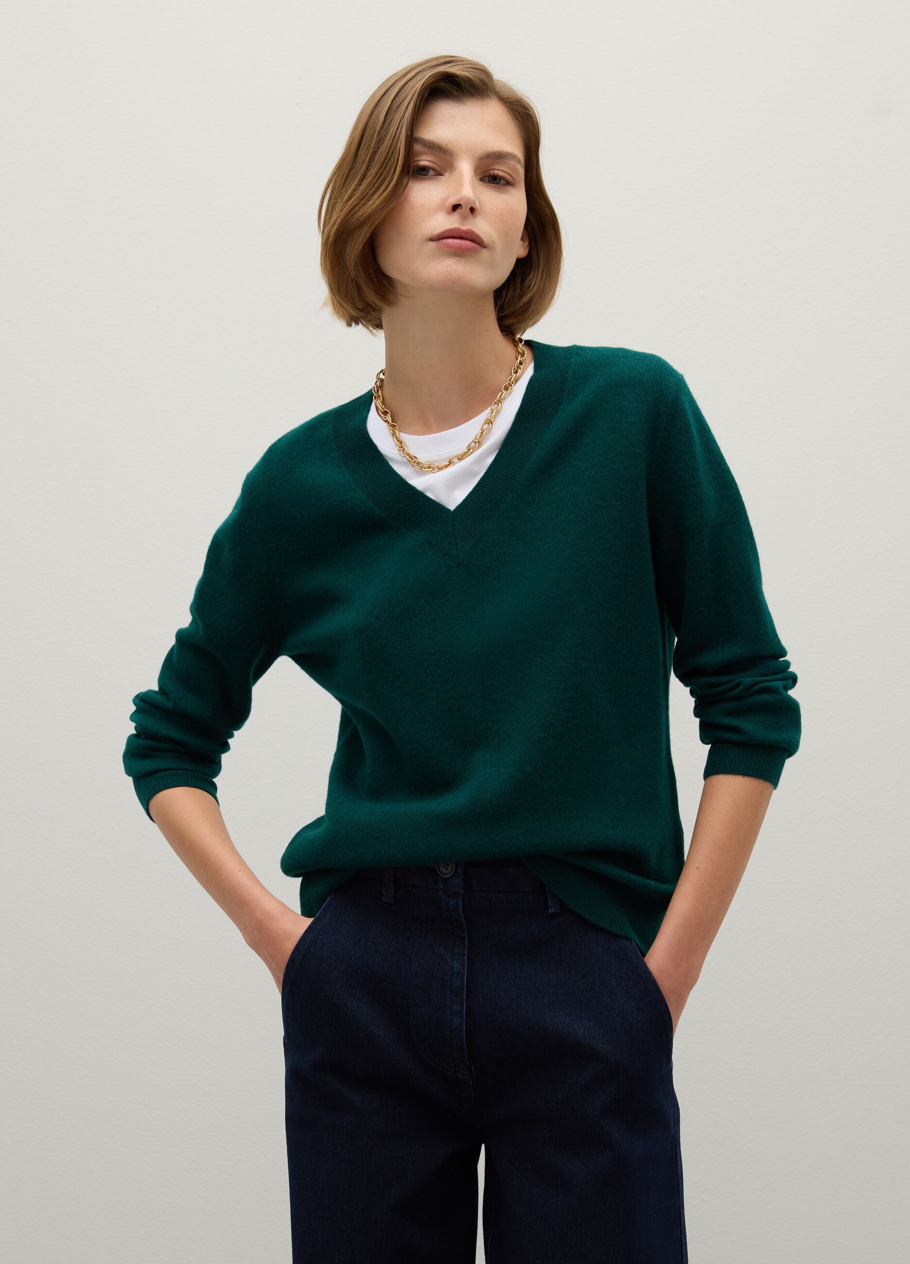 Green V-neck wool sweater