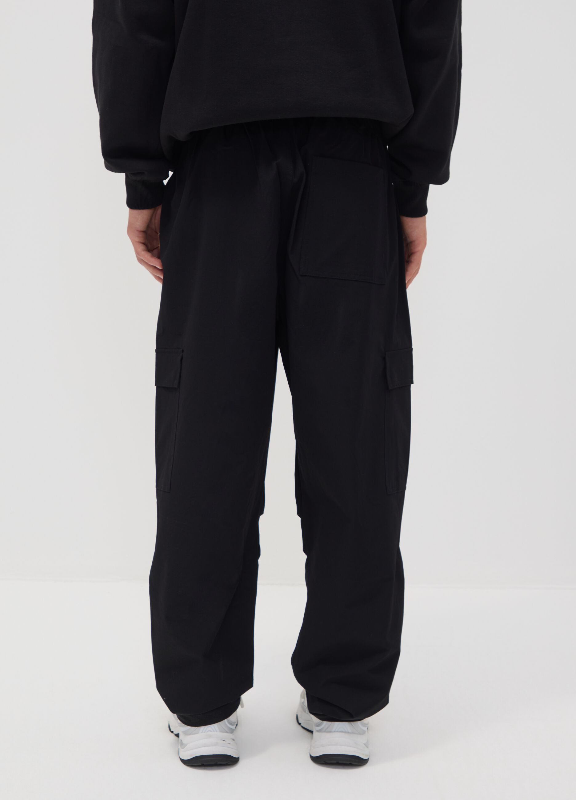 Black sporty cargo trousers with drawstring