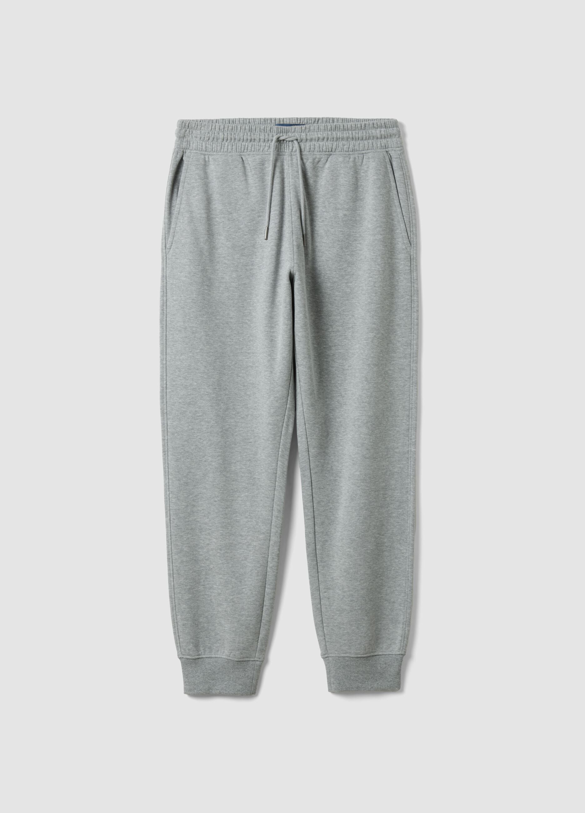 Grey cotton-blend joggers with cuffed hems and drawstring