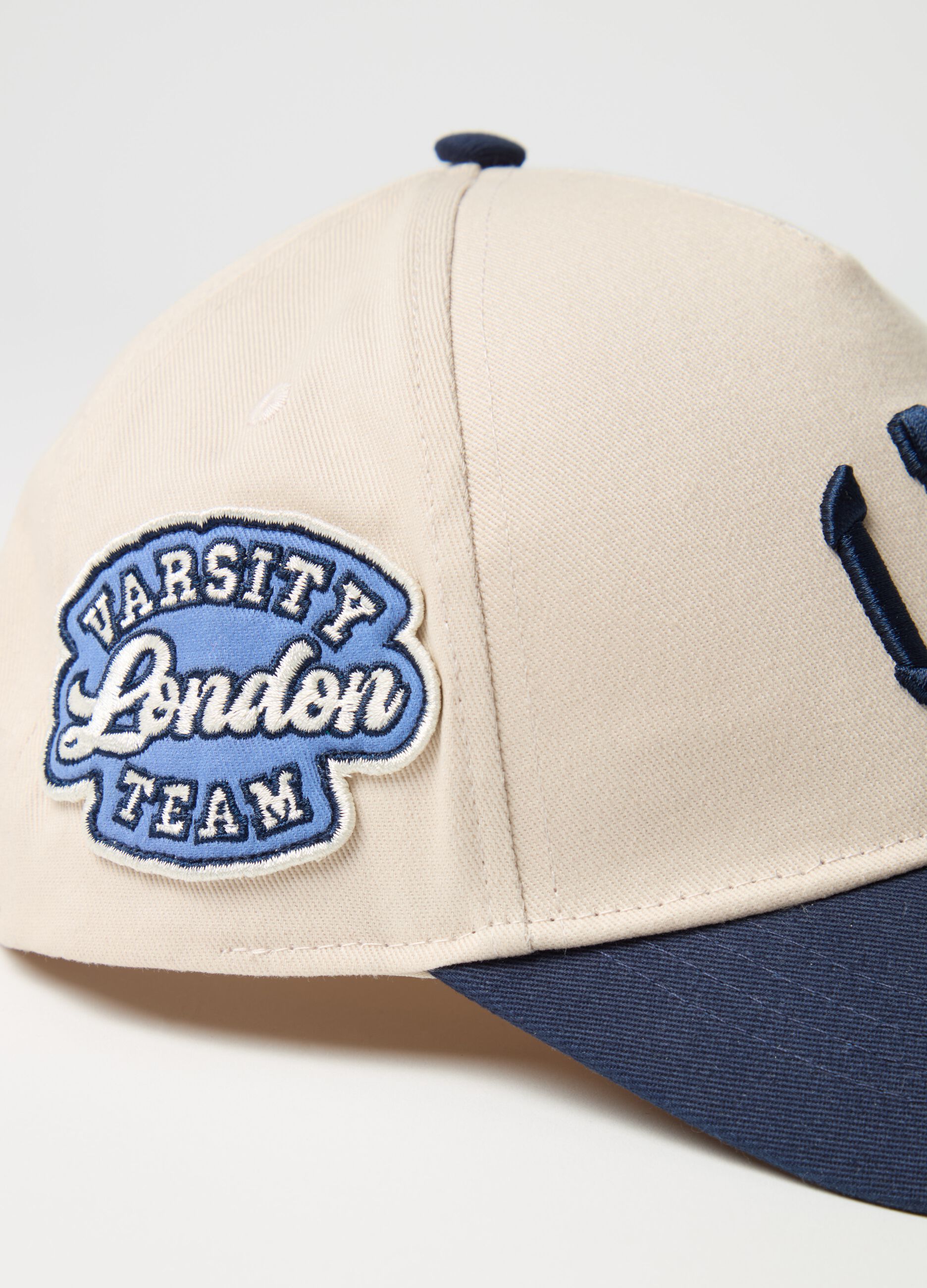 Baseball cap with "LND" embroidery and patch