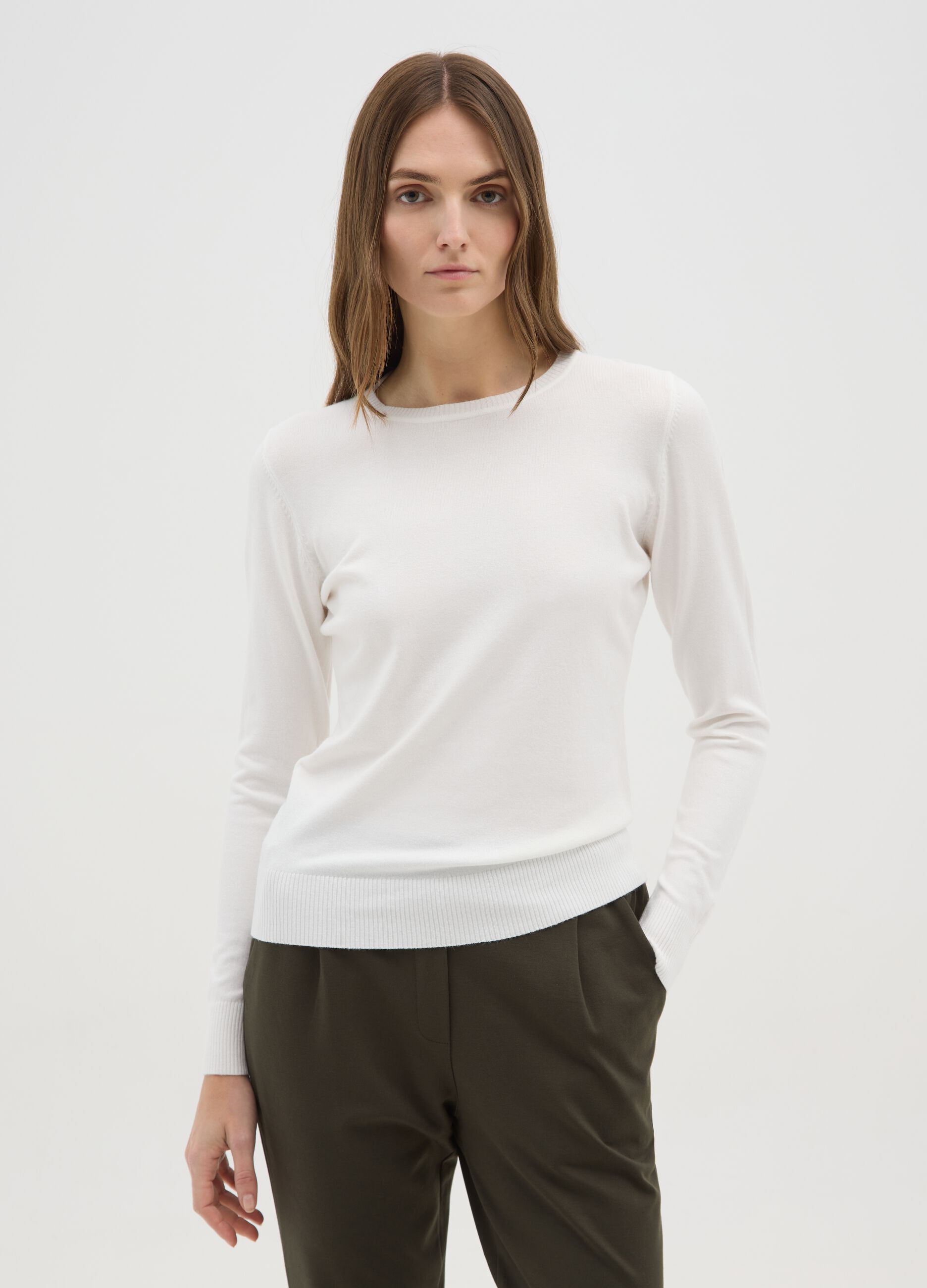 White crew-neck sweater with long sleeves