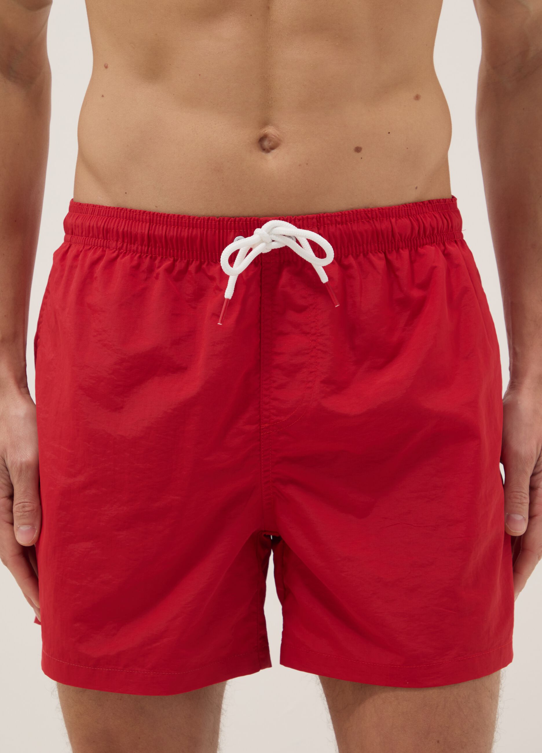 Red swim shorts with elasticated waist