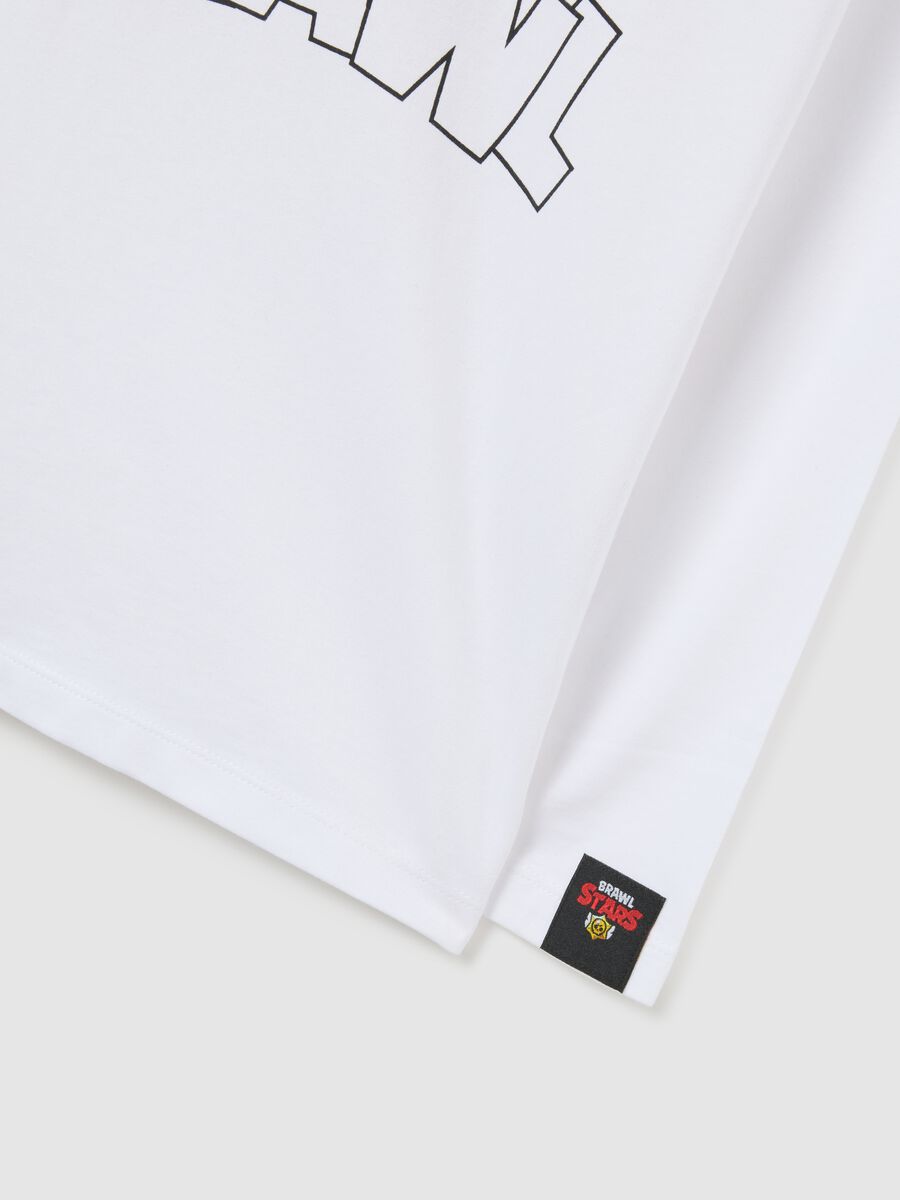 T-shirt bianca da bambino in puro cotone vestibilità over con stampe_2