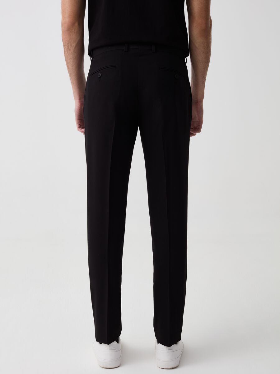 Solid colour slim-fit trousers_2