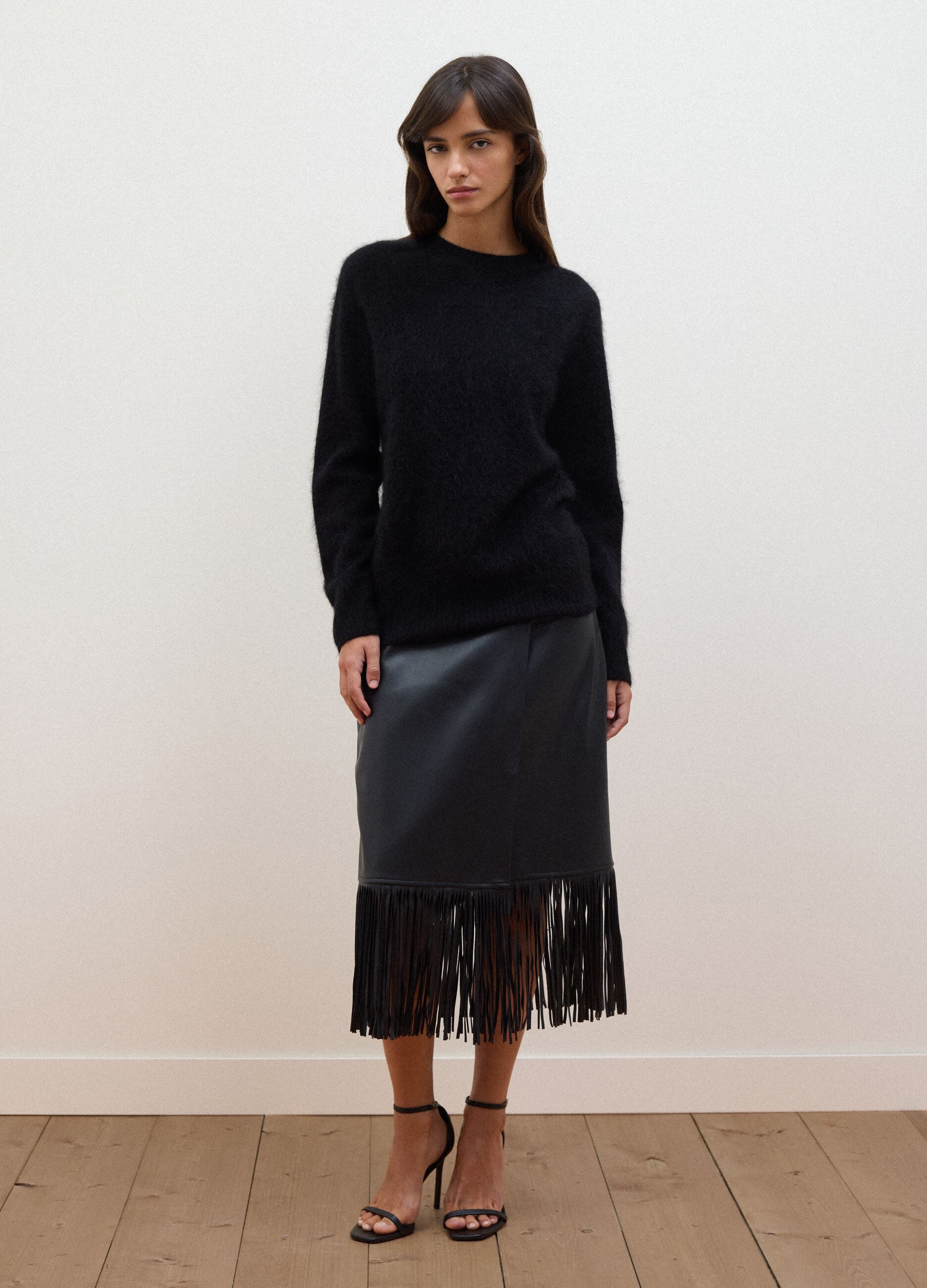 Black midi skirt with fringe hem