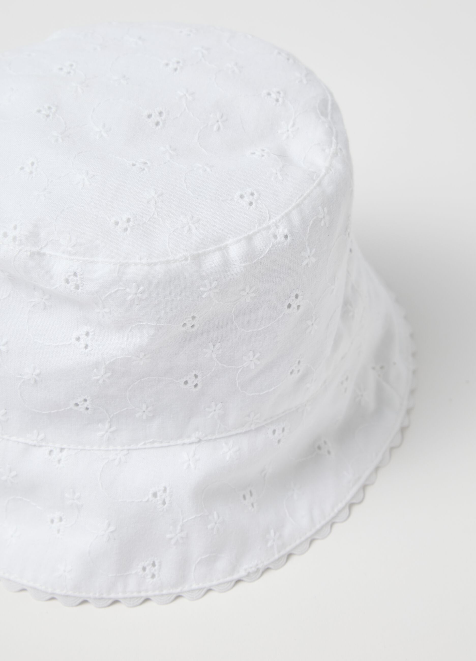 White cloche hat in broderie anglaise
