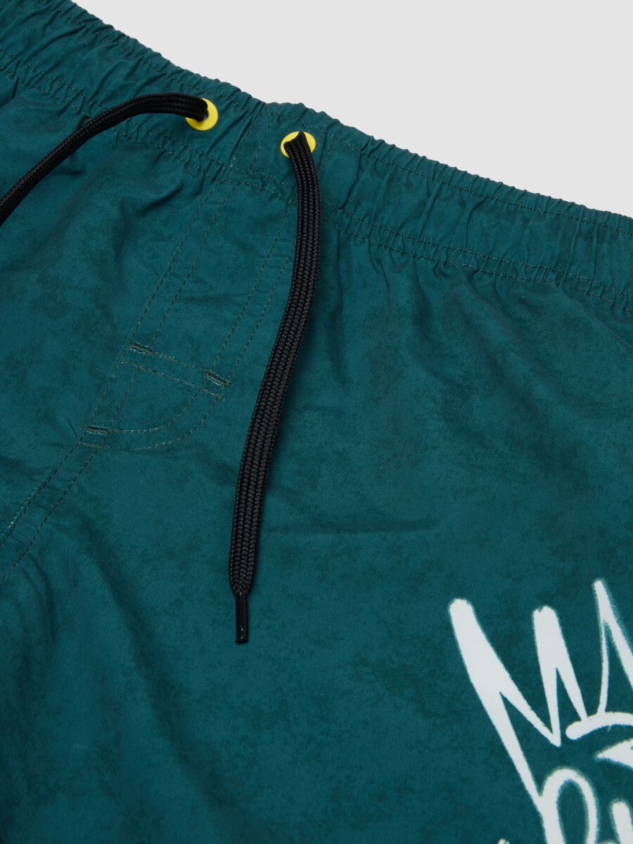 Green swim shorts with graphic print_2