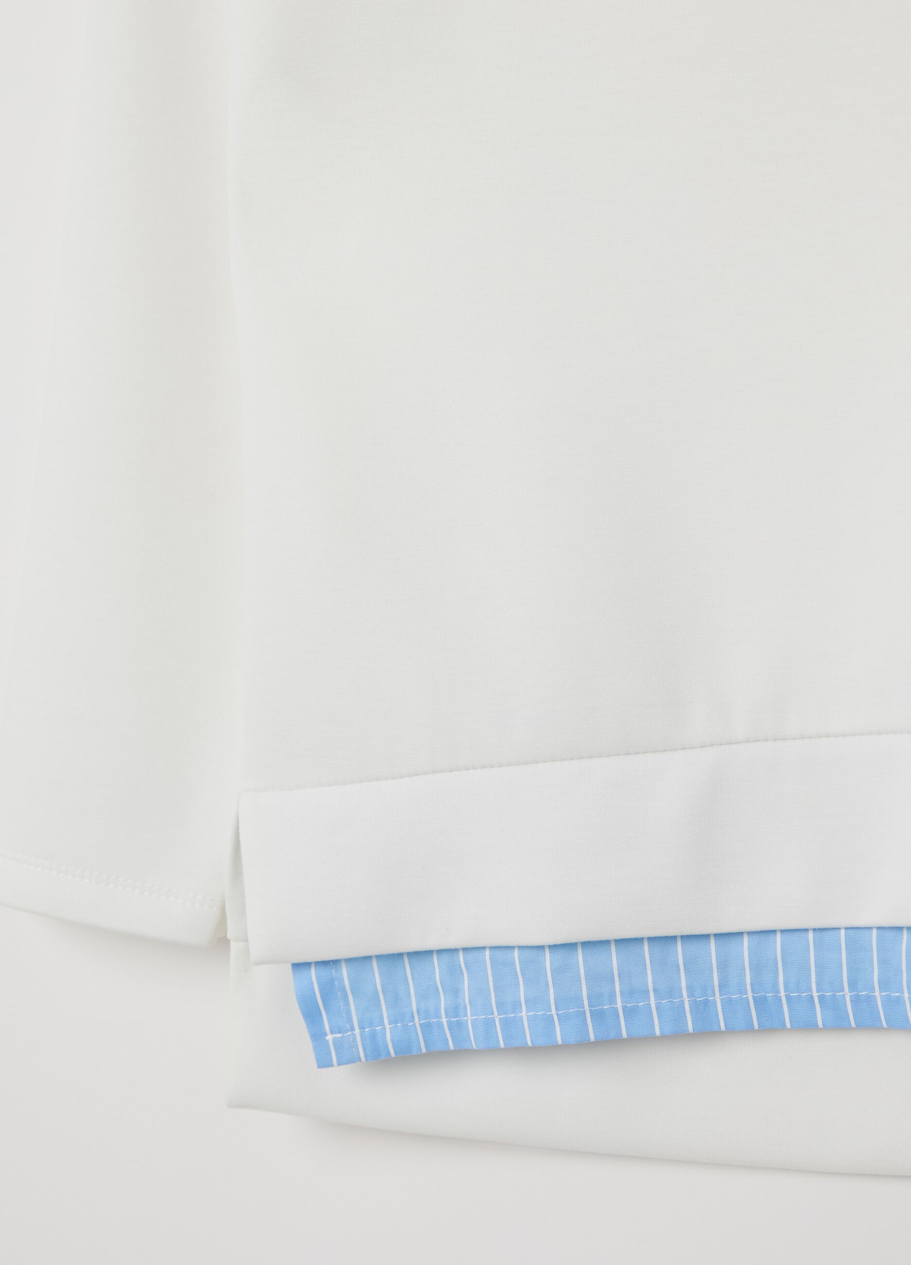 White top with layered-effect hem