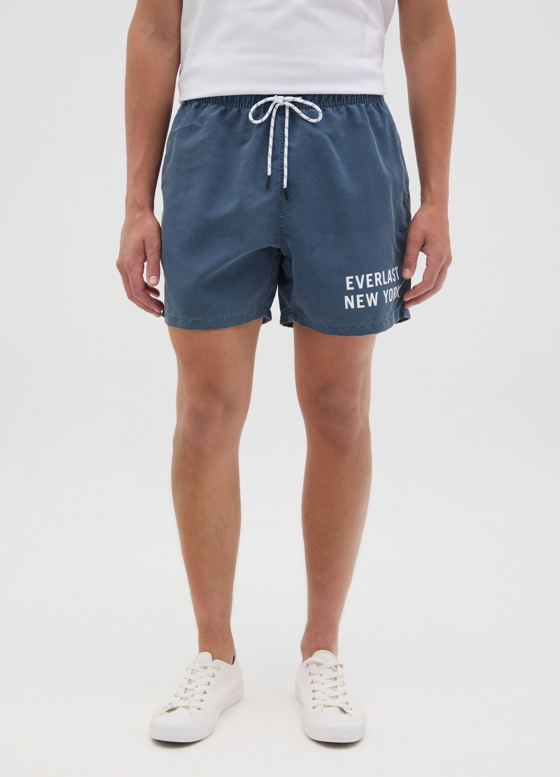 Blue swimming trunks with logo print