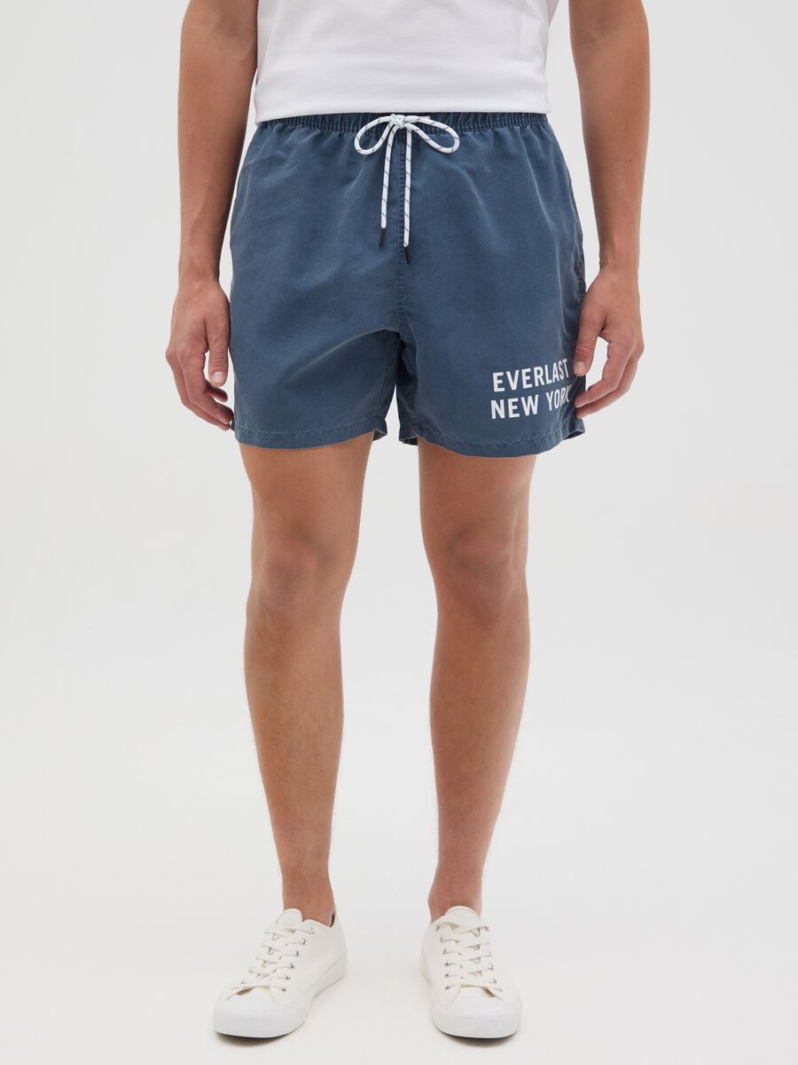 Blue swimming trunks with logo print_1