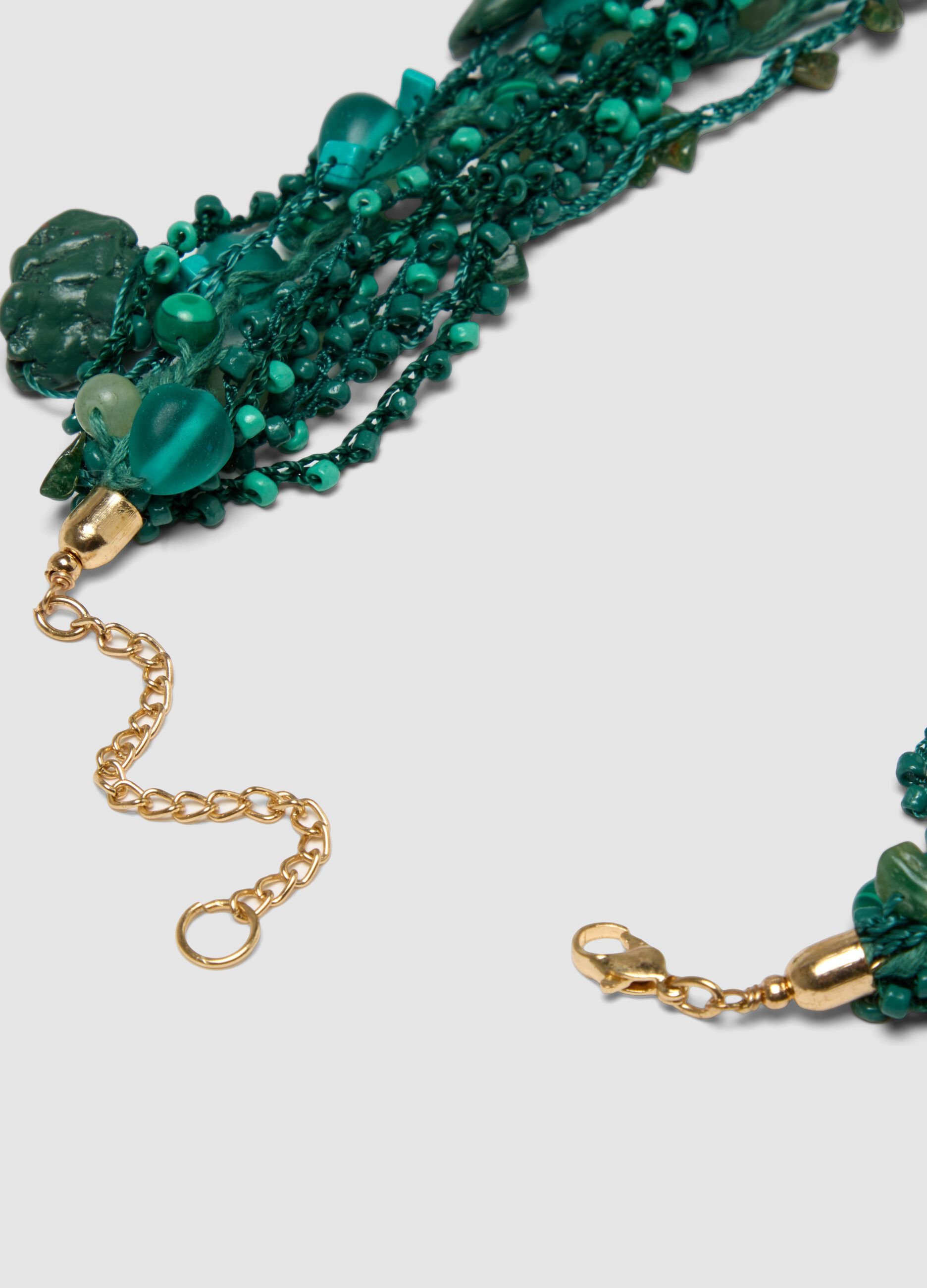 Green multi-strand necklace with decorative stones