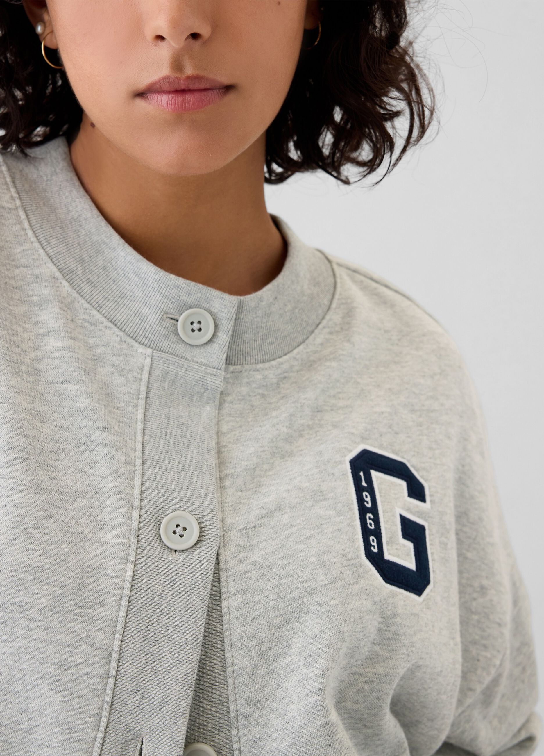 Oversized sweatshirt with buttons and logo embroidery