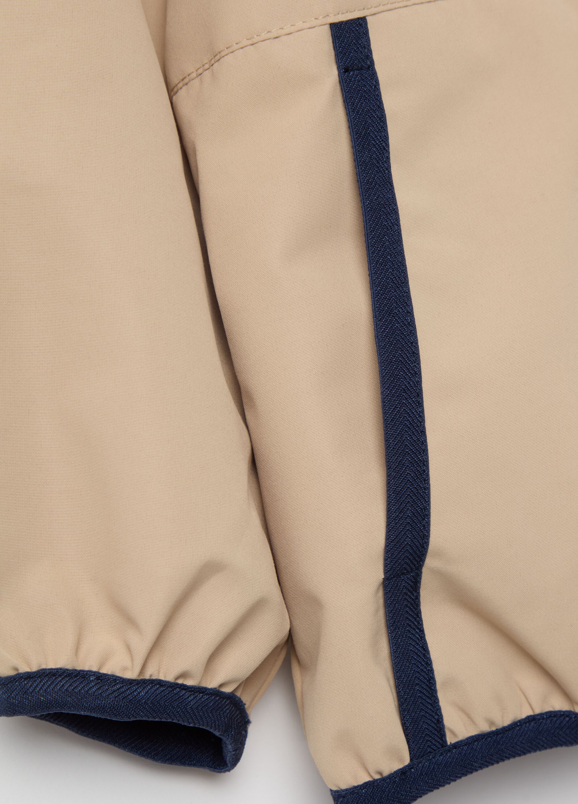 Jacket with hood and contrasting edging