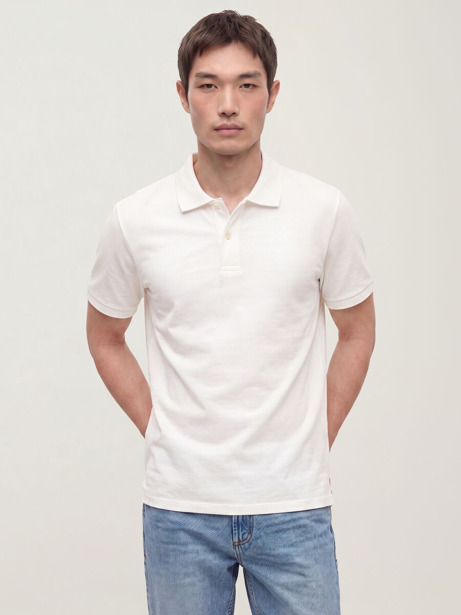 Polo bianca in puro cotone piquet con colletto classico regular fit_0