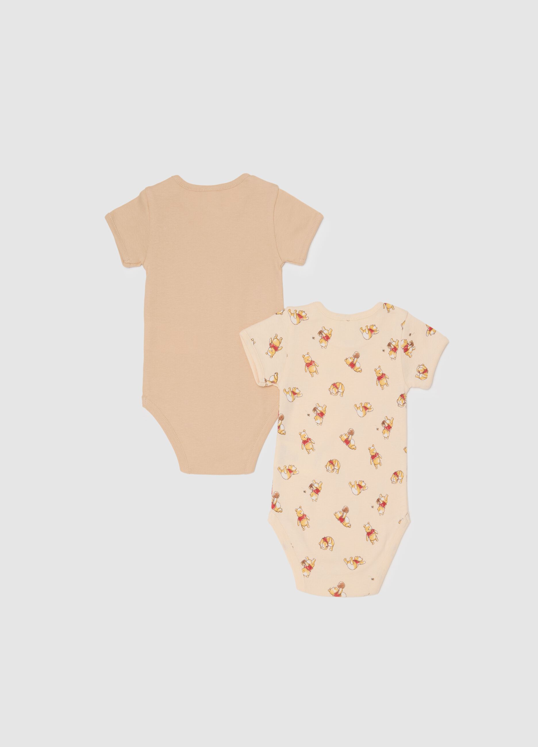 Unisex baby bodysuit in pure beige cotton with Winnie the Pooh print
