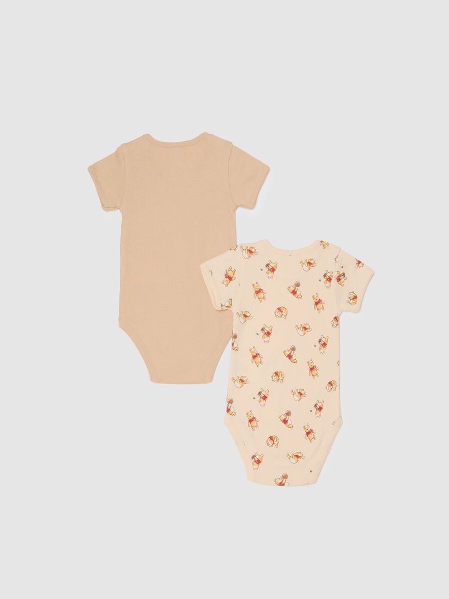 Unisex baby bodysuit in pure beige cotton with Winnie the Pooh print_1