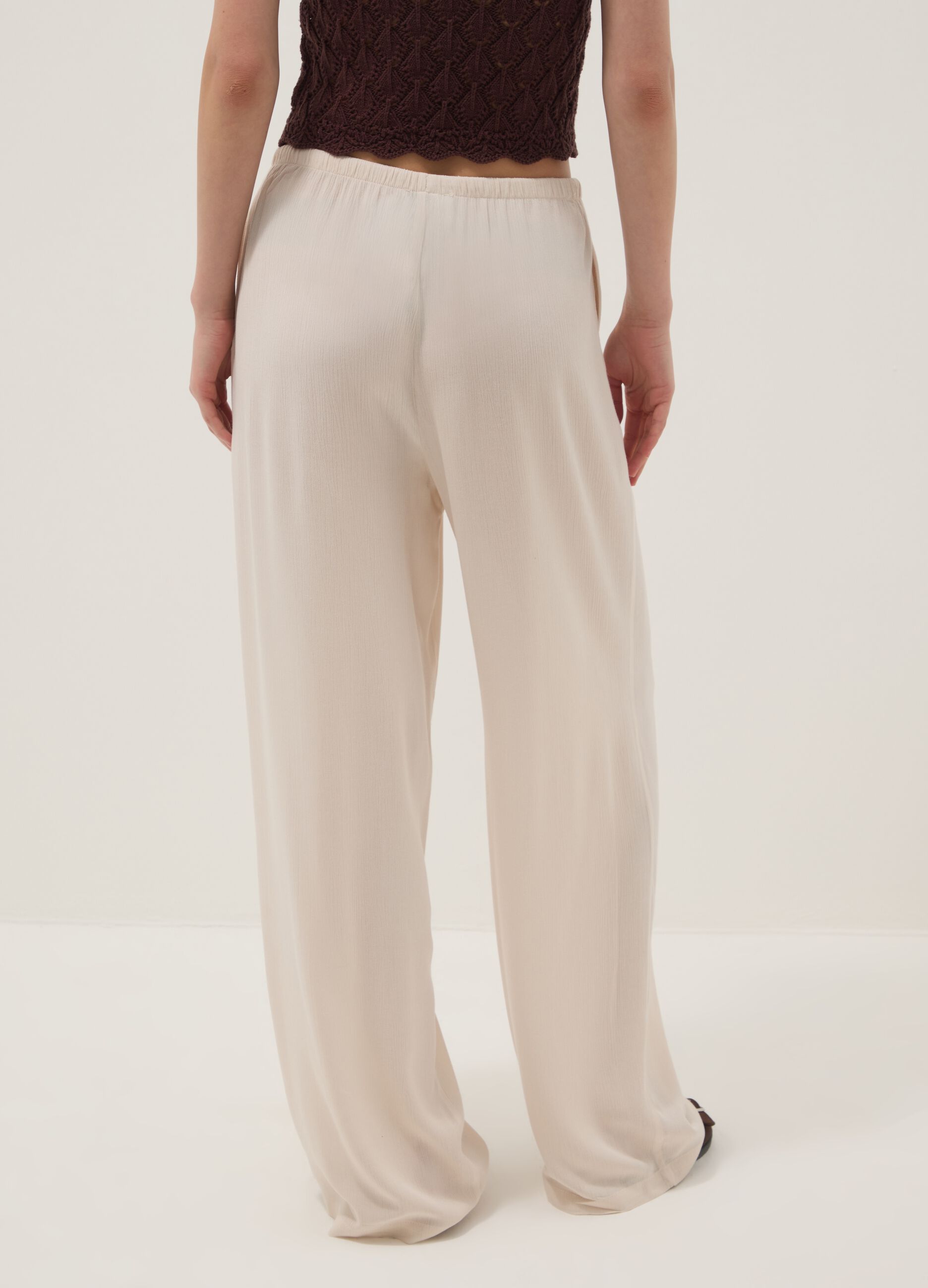 Beige palazzo trousers in pure viscose