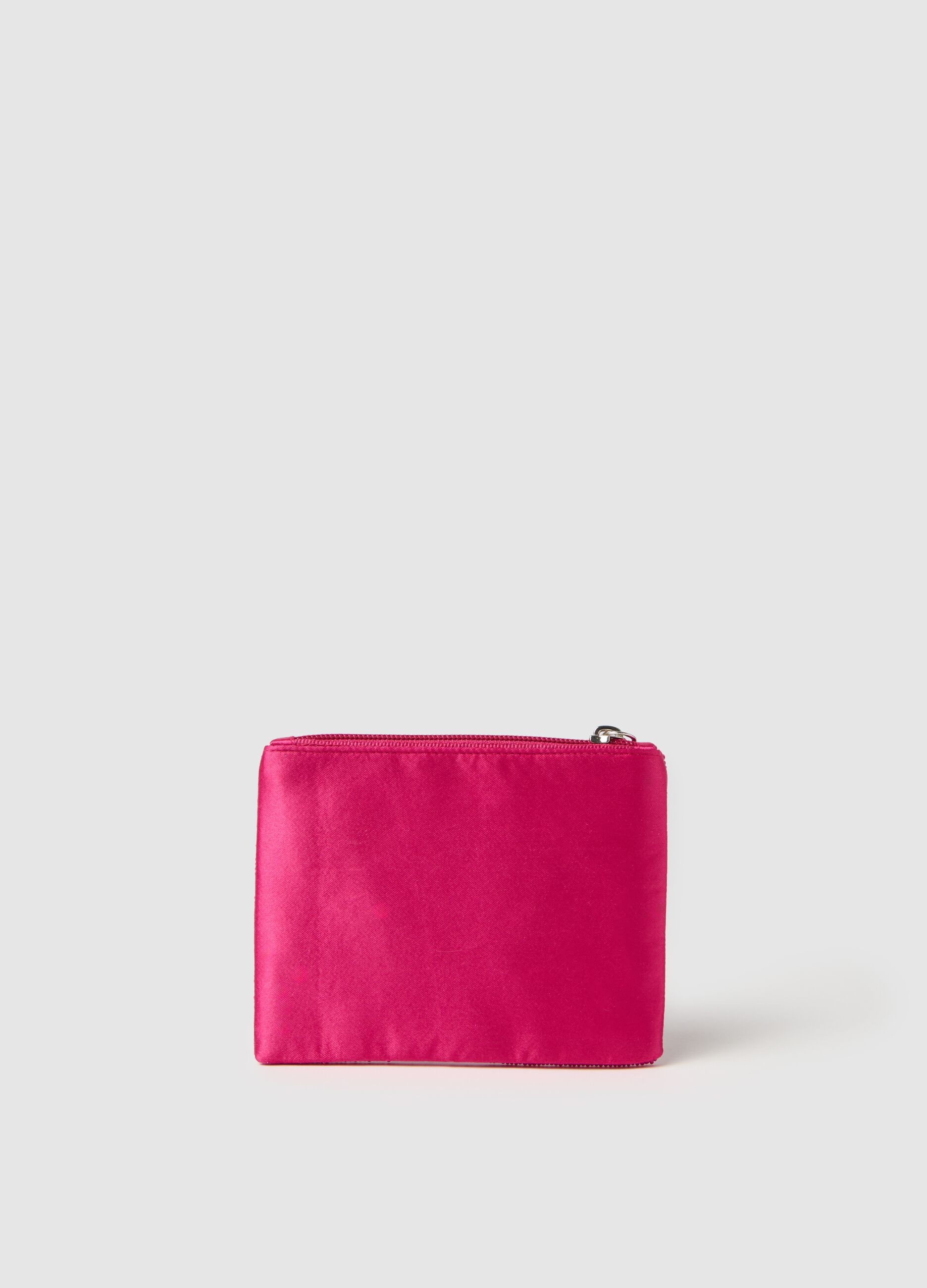Pink glass purse with decoration