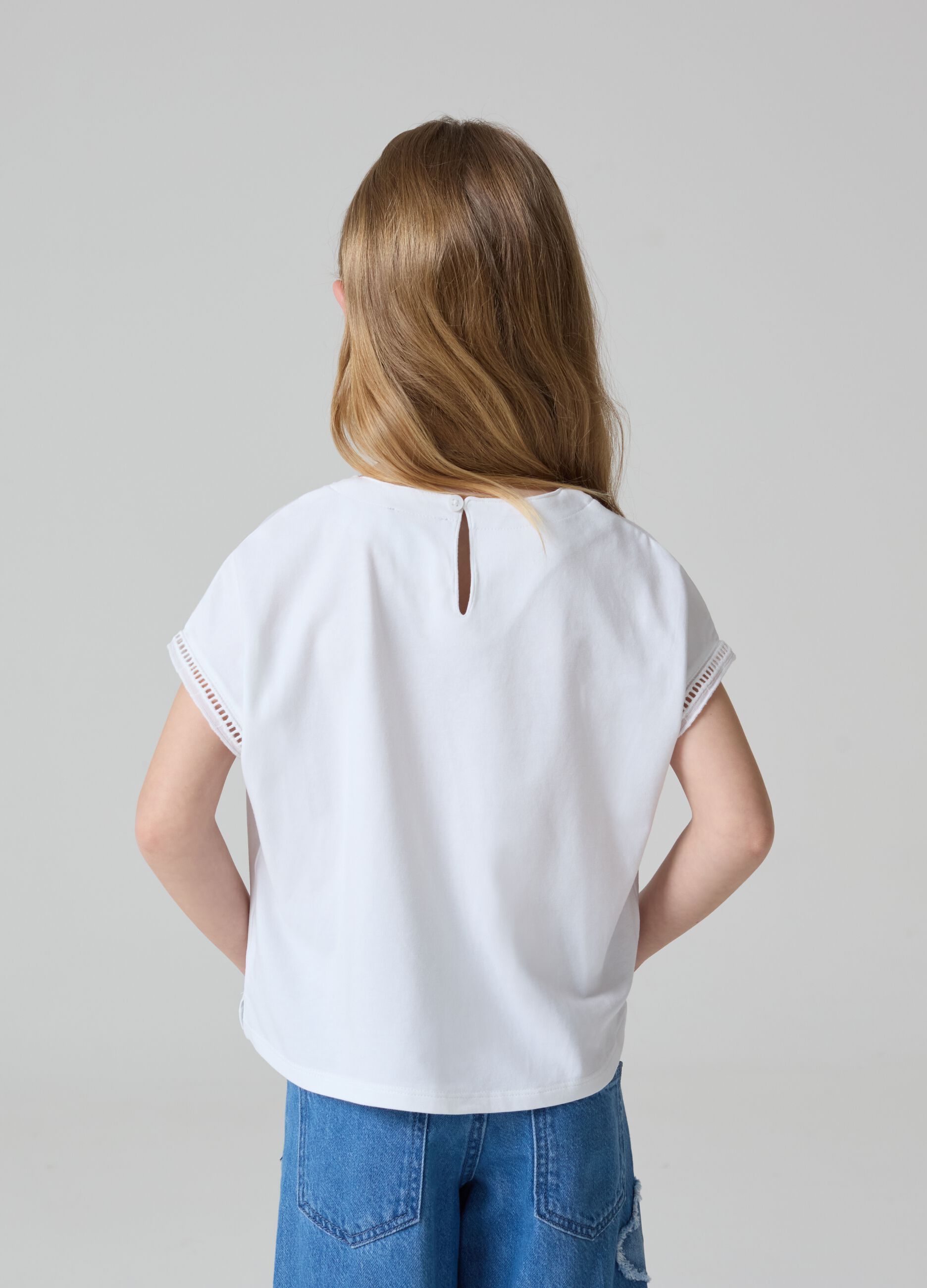 T-shirt tinta unita con inserti traforati