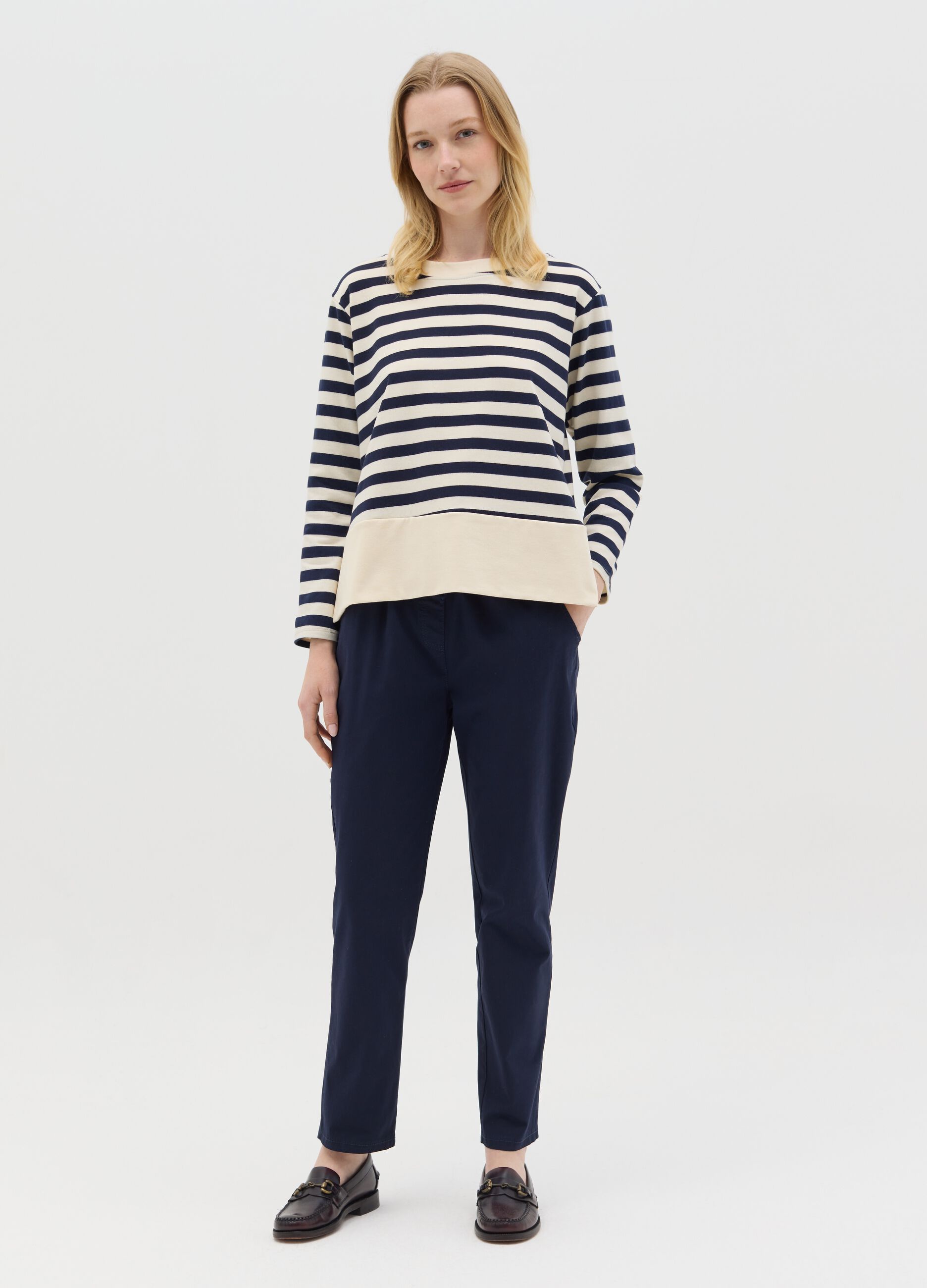 Blue and white striped top with long sleeves
