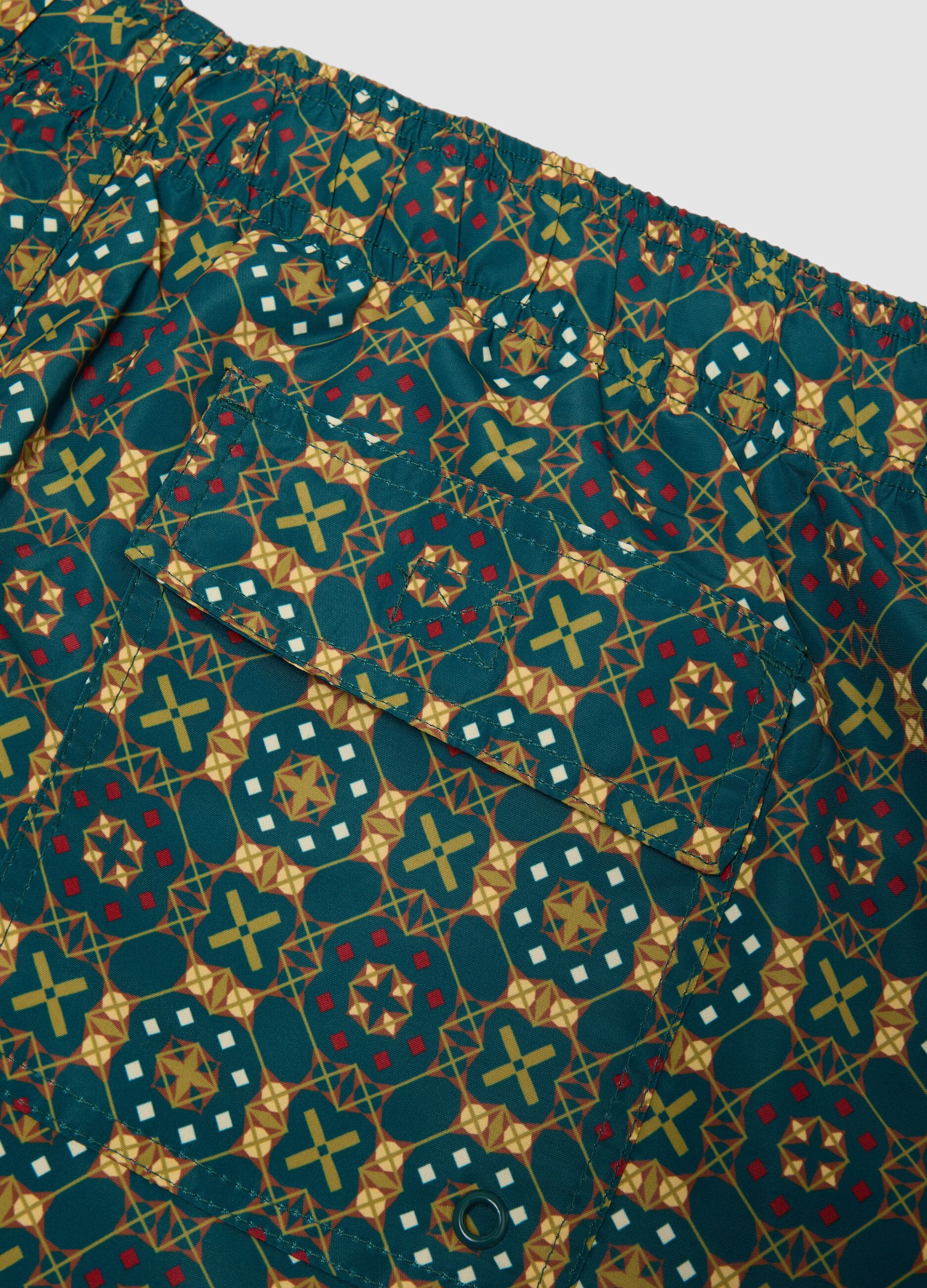 Green patterned swim shorts with elasticated waist