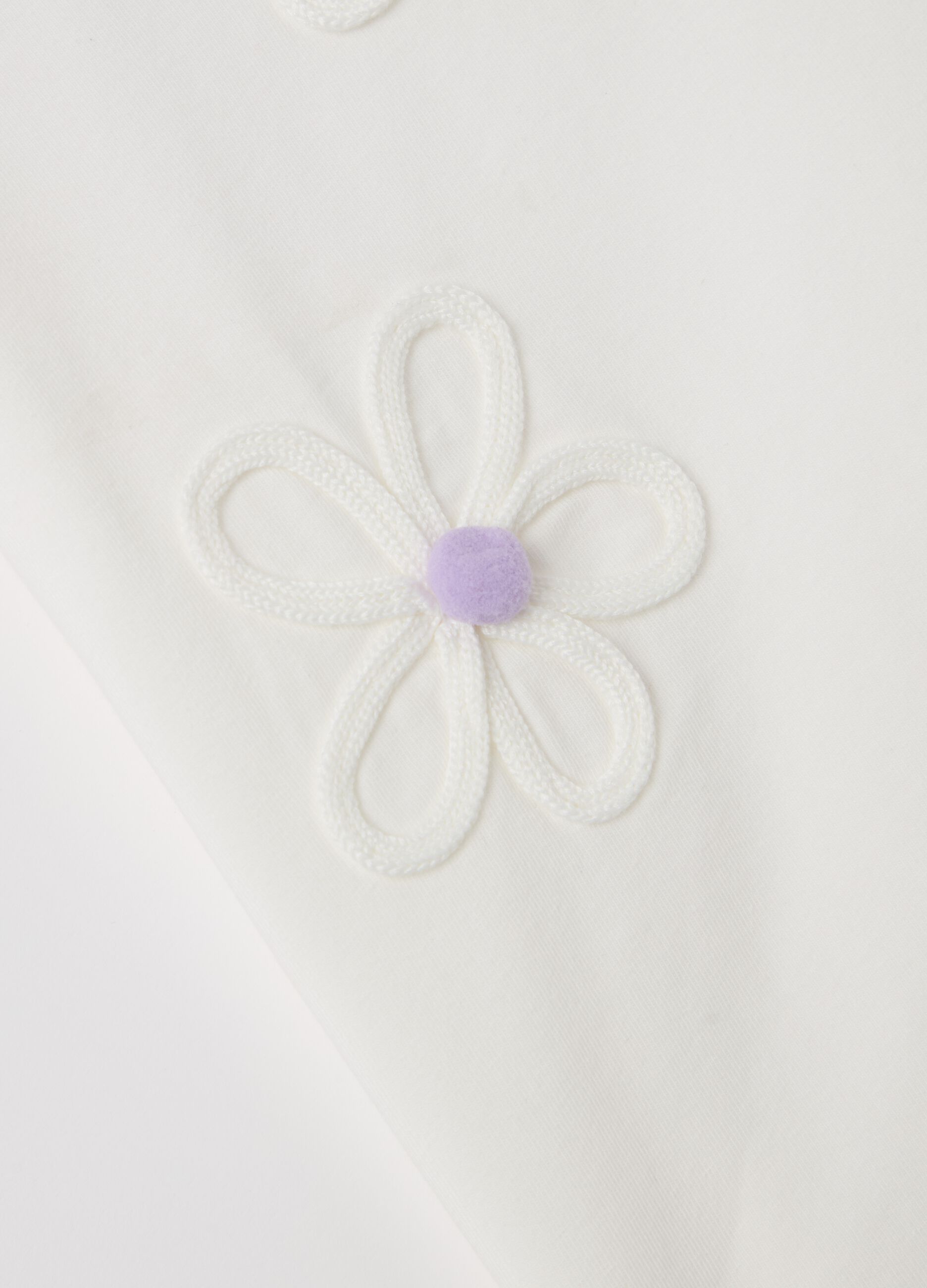 T-shirt with flowers application and pompoms