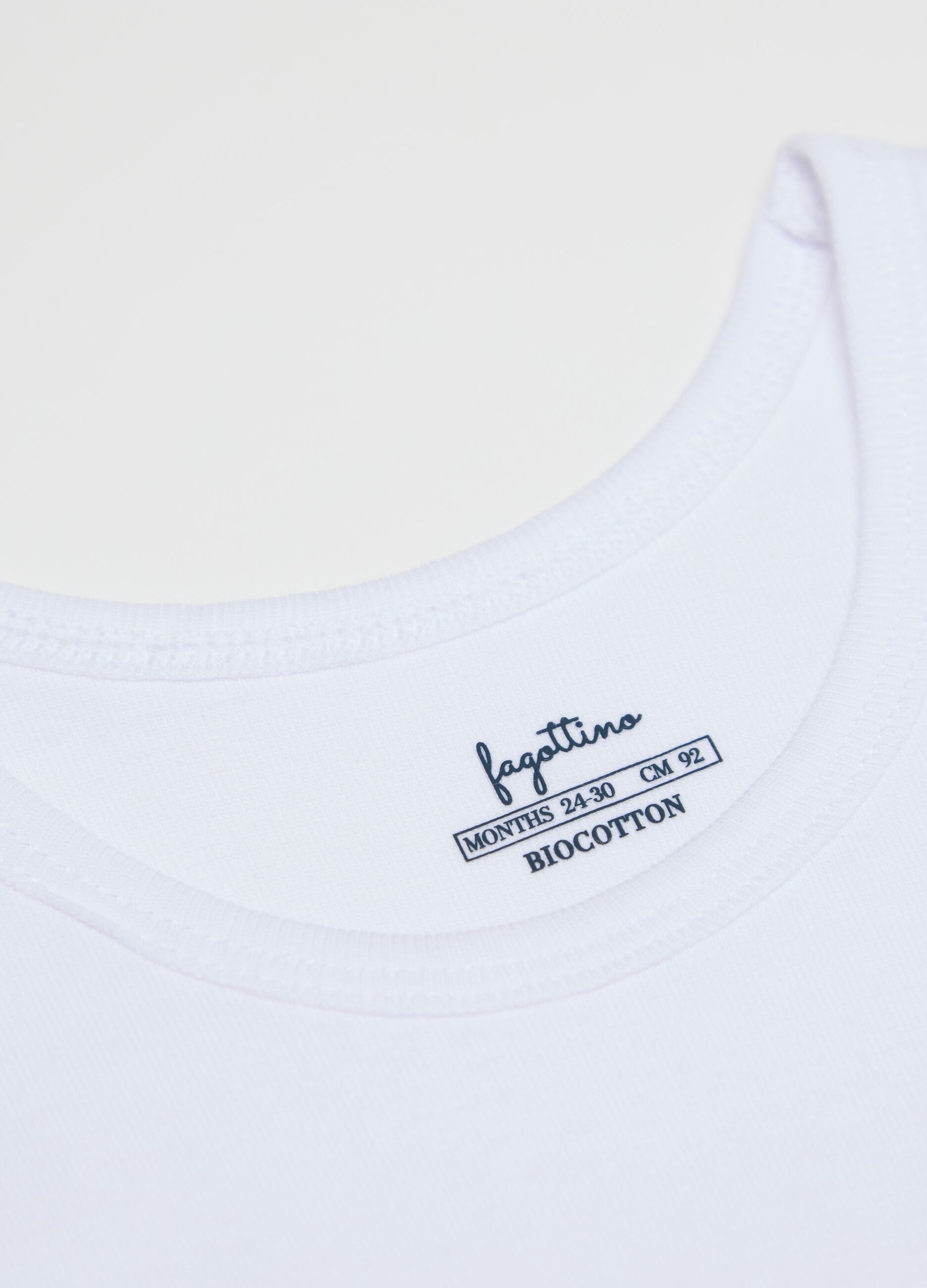 Three-pack white racerback vests in organic cotton