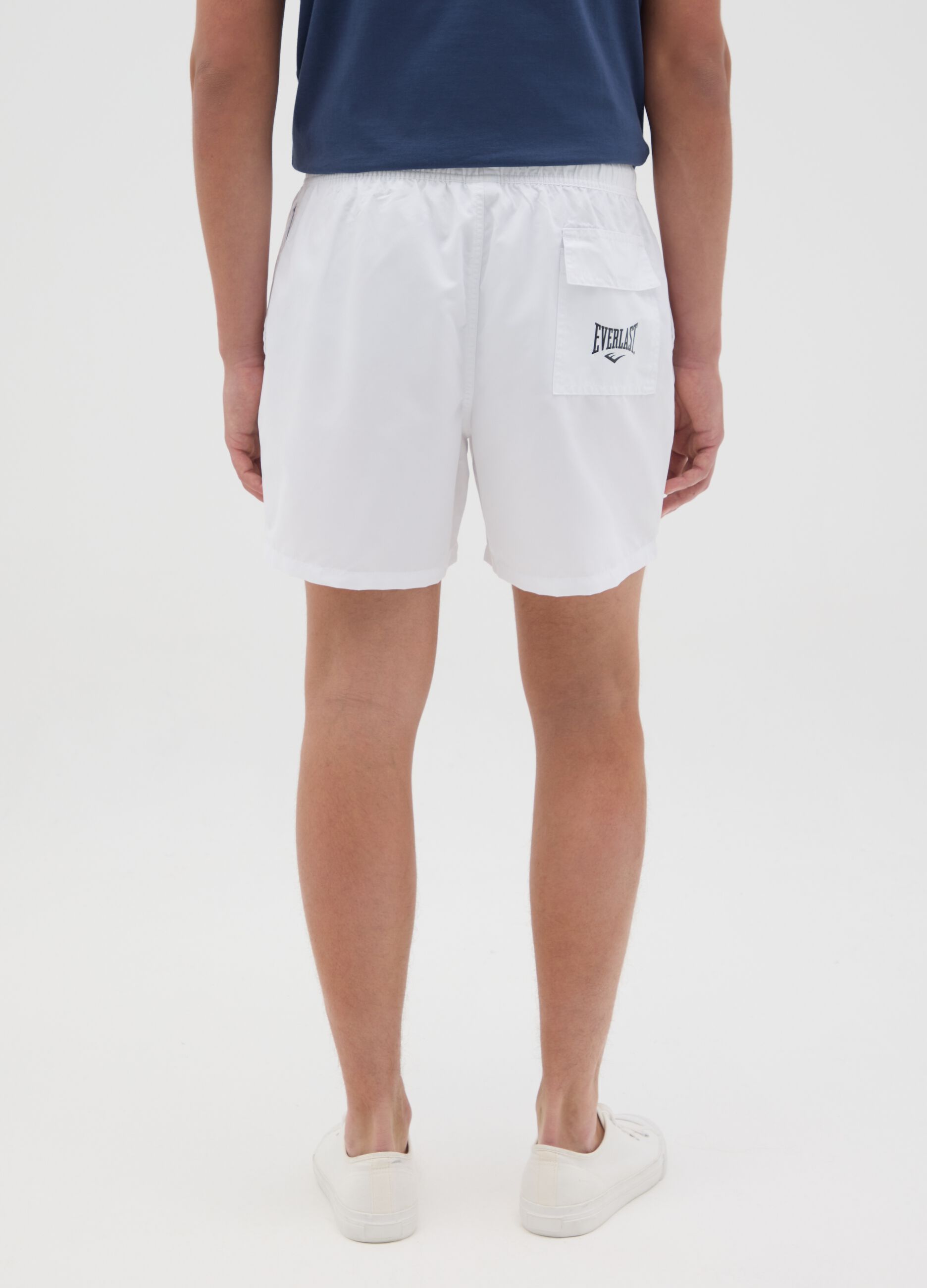White swimming trunks with logo print