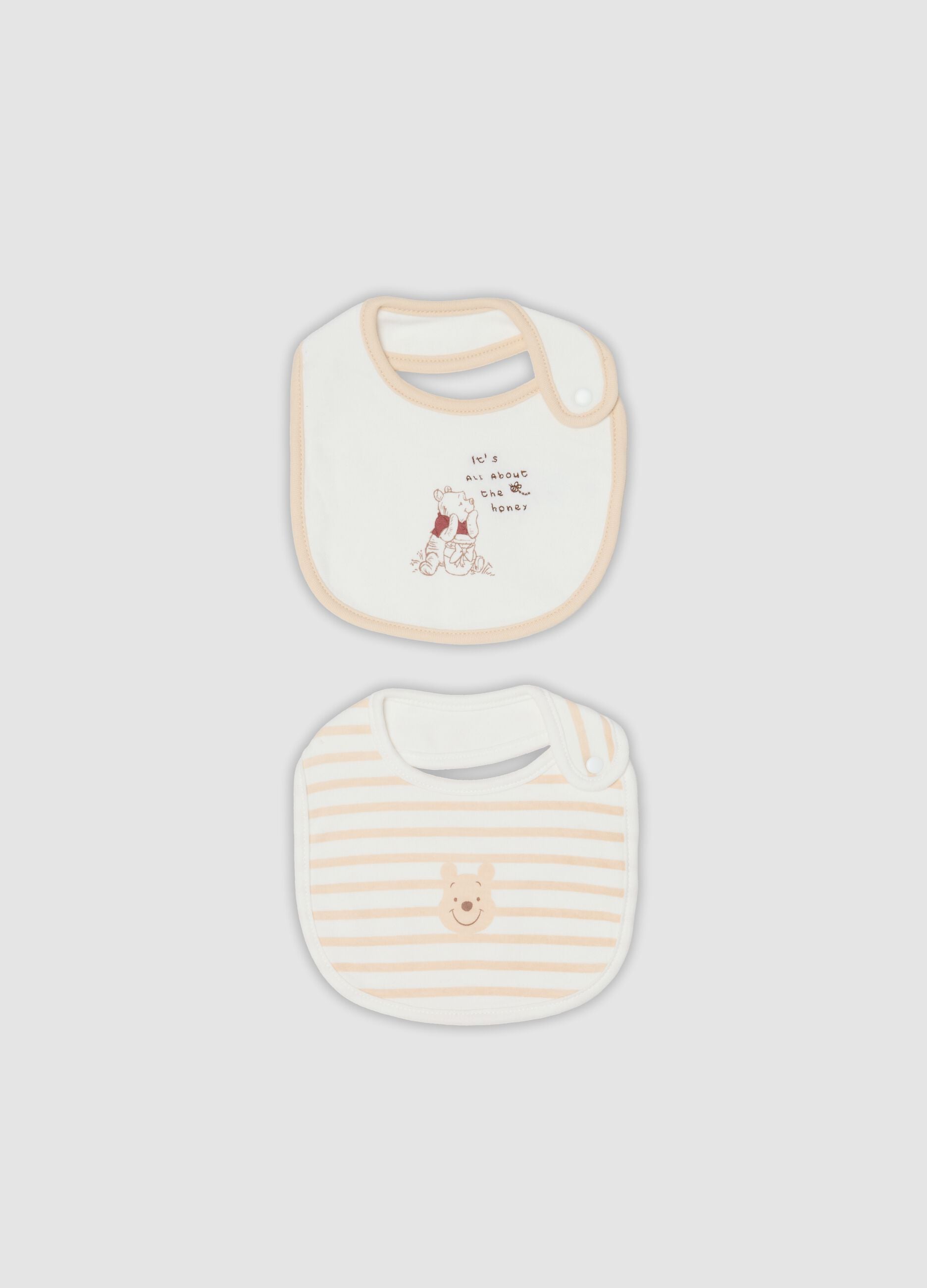 2-pack of white organic cotton Winnie the Pooh bibs