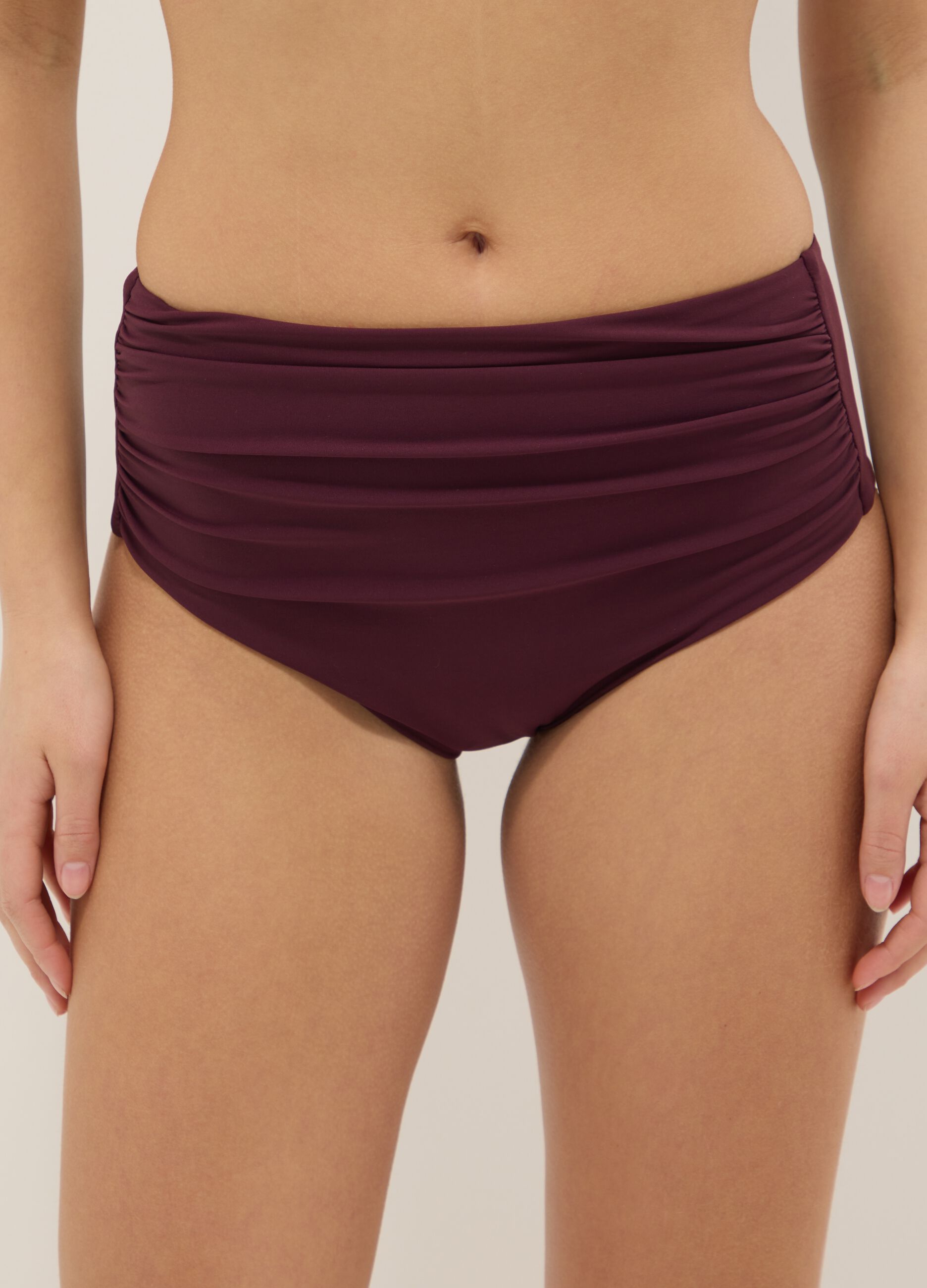 Purple high-waist stretch bikini bottoms with shaping effect