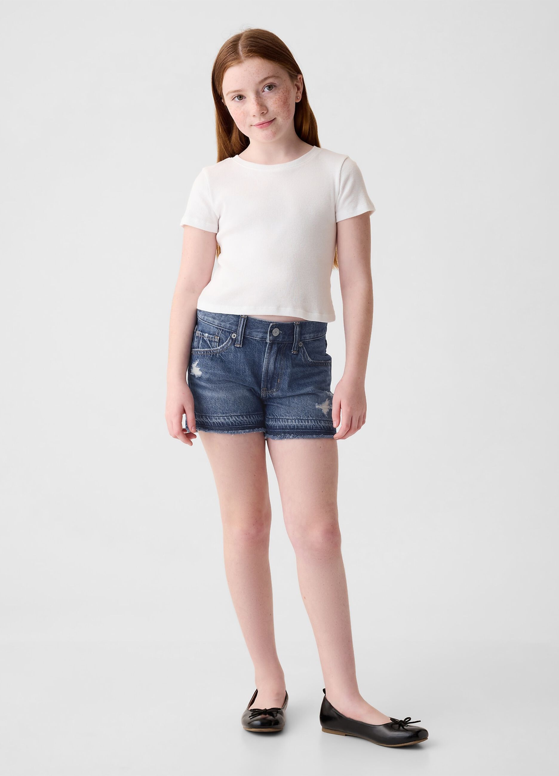 Low-rise denim shorts with abrasions